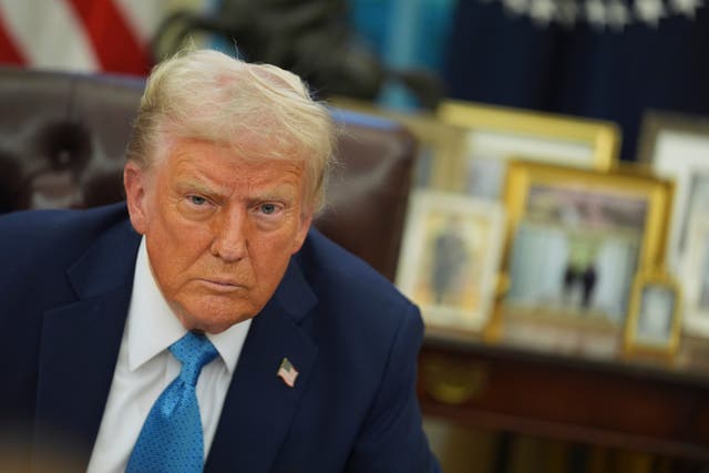 <p>President Donald Trump speaks to reporters as he signs executive orders in the Oval Office</p>