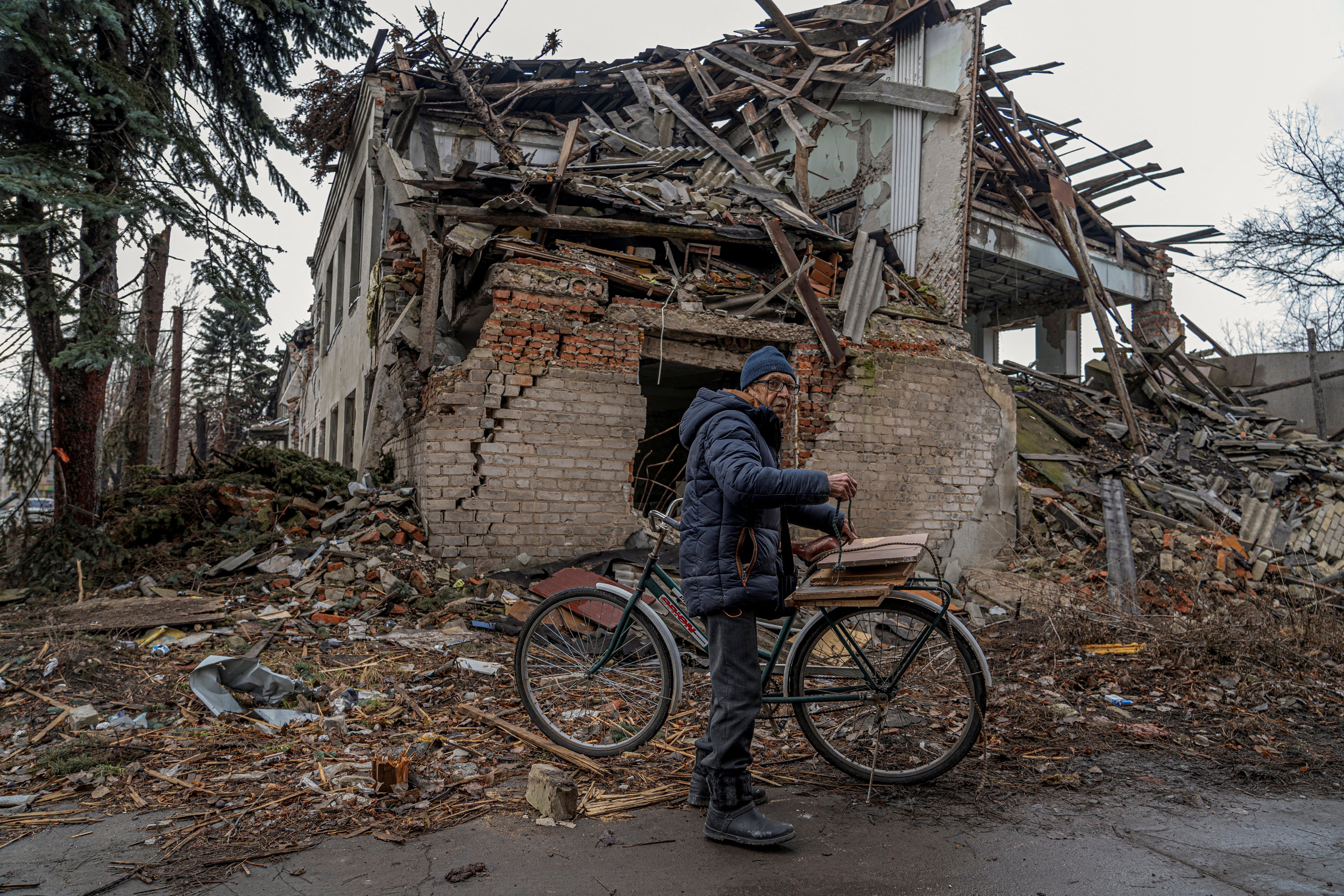 A man searches for firewood in Pokrovsk, eastern Ukraine, in the face of fierce Russian attacks