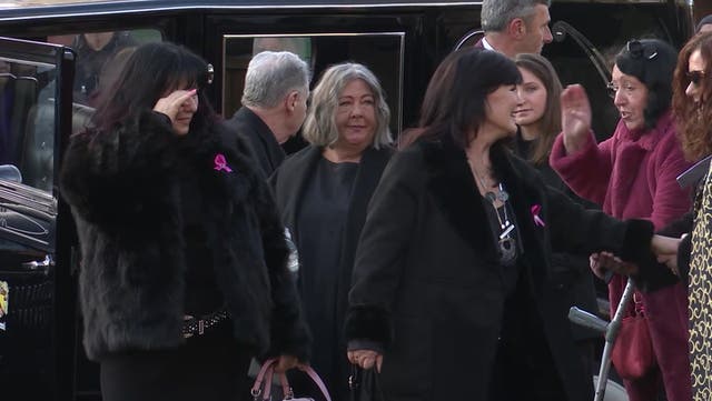 <p>Coleen Nolan wipes away tears as sister Linda Nolan laid to rest in pink coffin.</p>