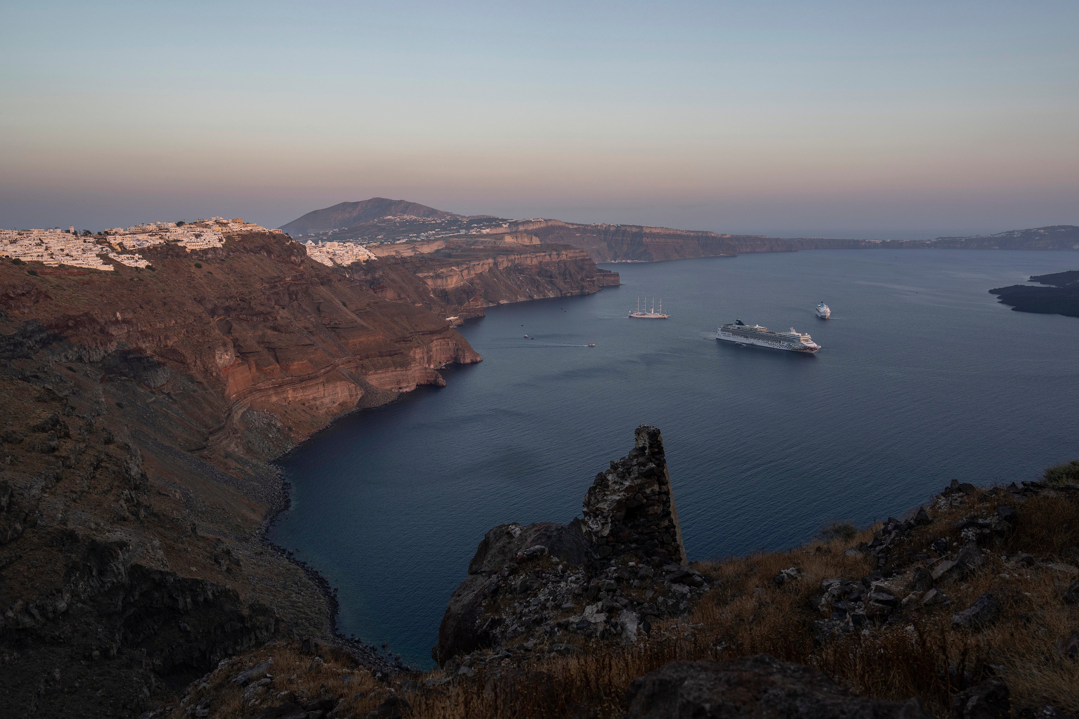 - Ruins of a settlement, including a former Catholic monastery, lie on the rocky promontory of Skaros on the Greek island of Santorini, on June 15