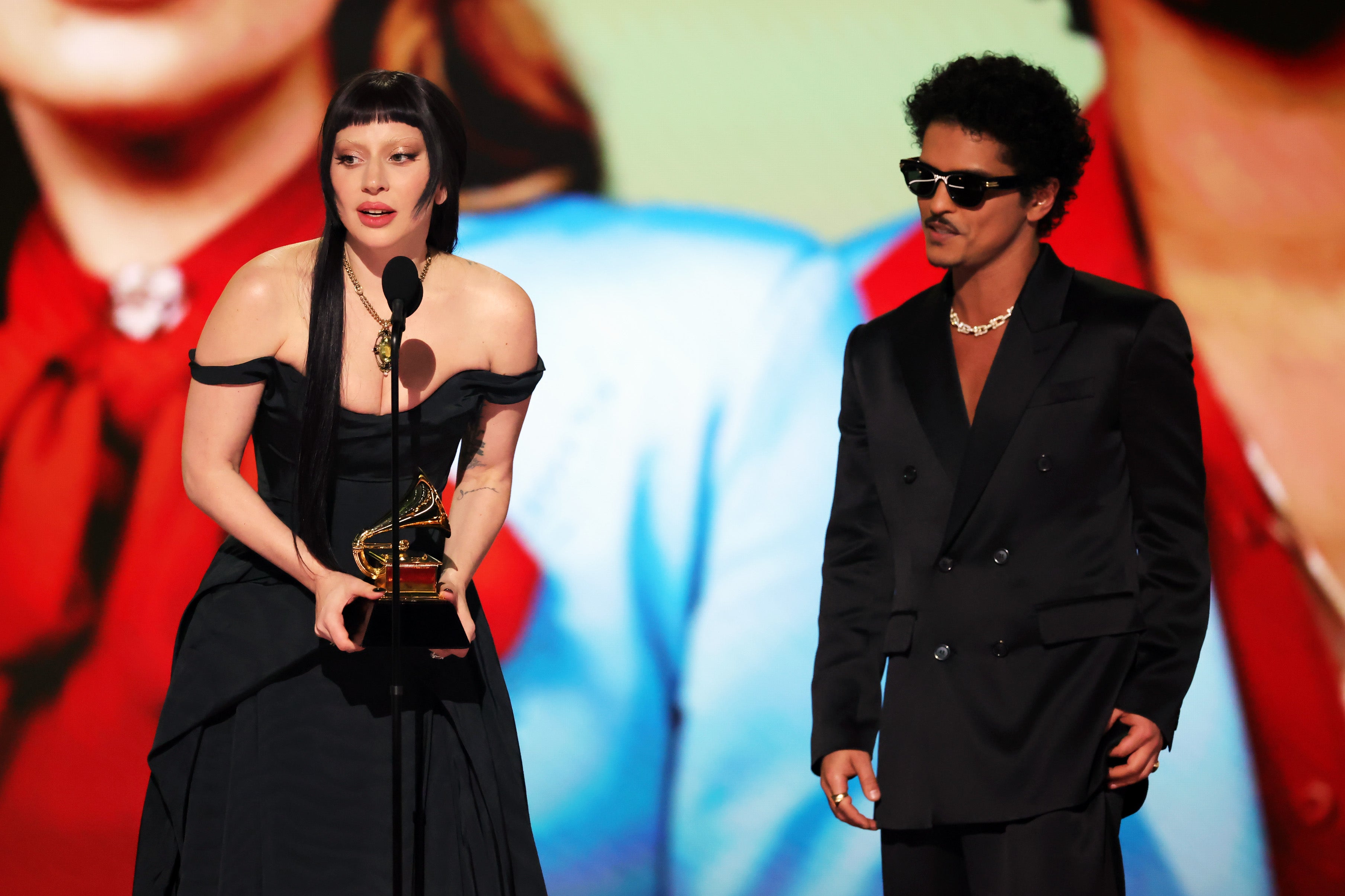 Lady Gaga and Bruno Mars accept the Best Pop Duo/Group Performance Award at the 2025 Grammys
