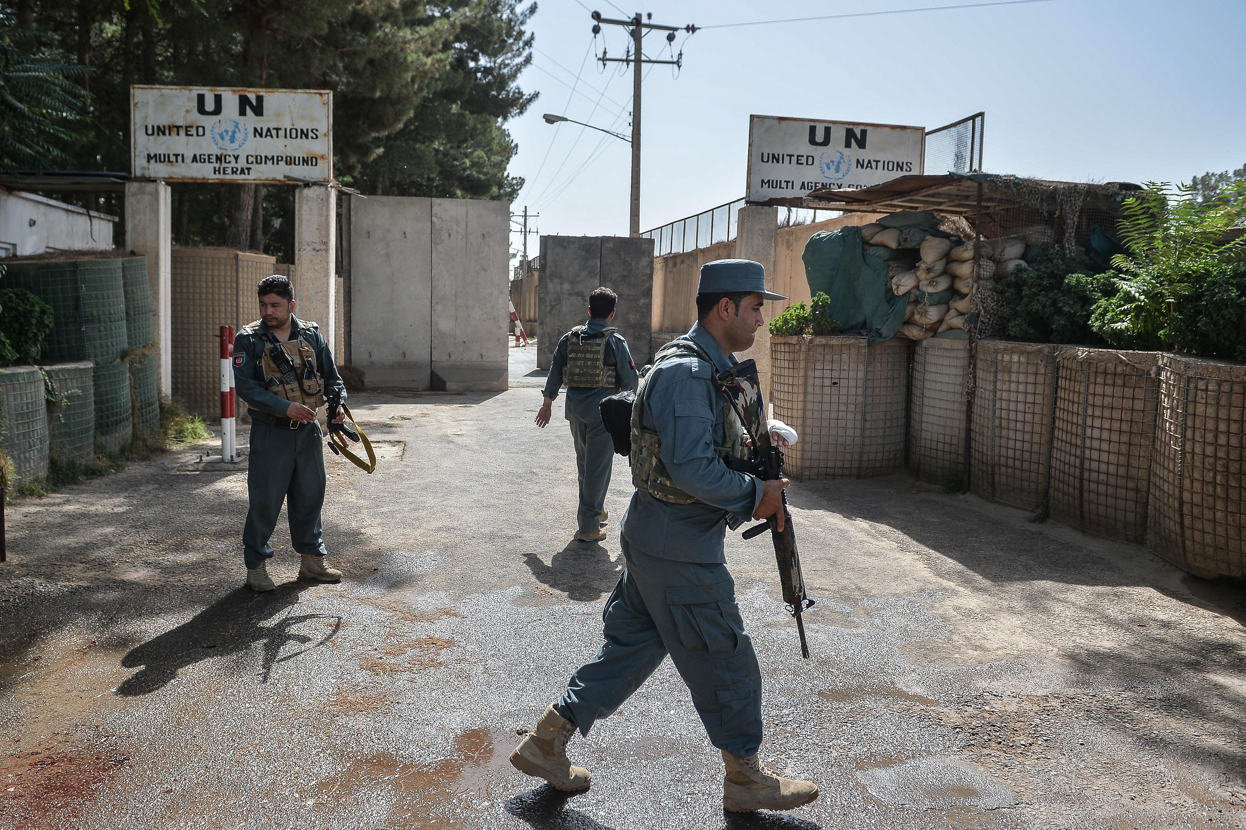 File. Security personnel stand guard outside United Nations Assistance Mission in Afghanistan office compound in Guzara district of Herat province on 31 July 2021