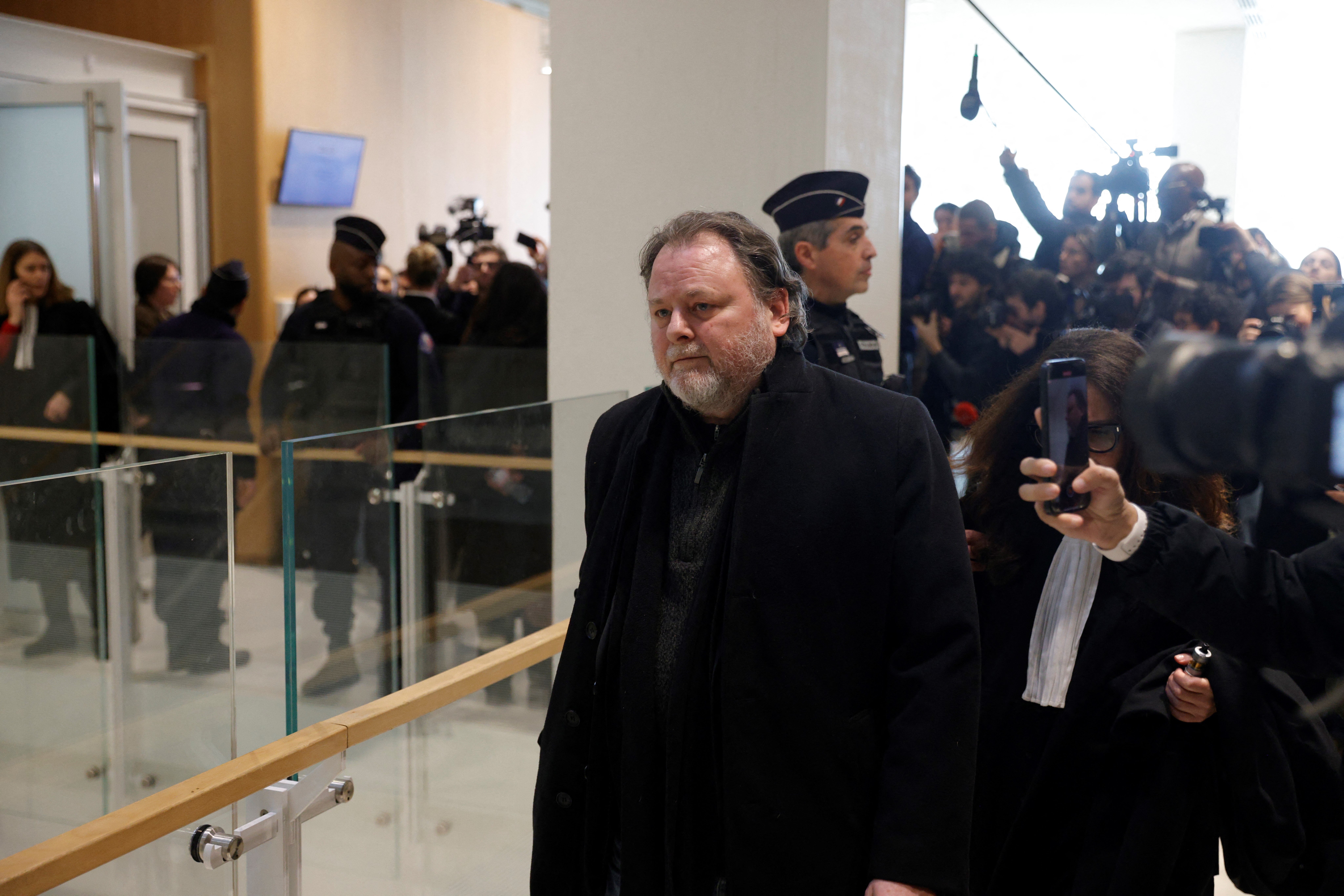 French director Christophe Ruggia leaves the court following his conviction