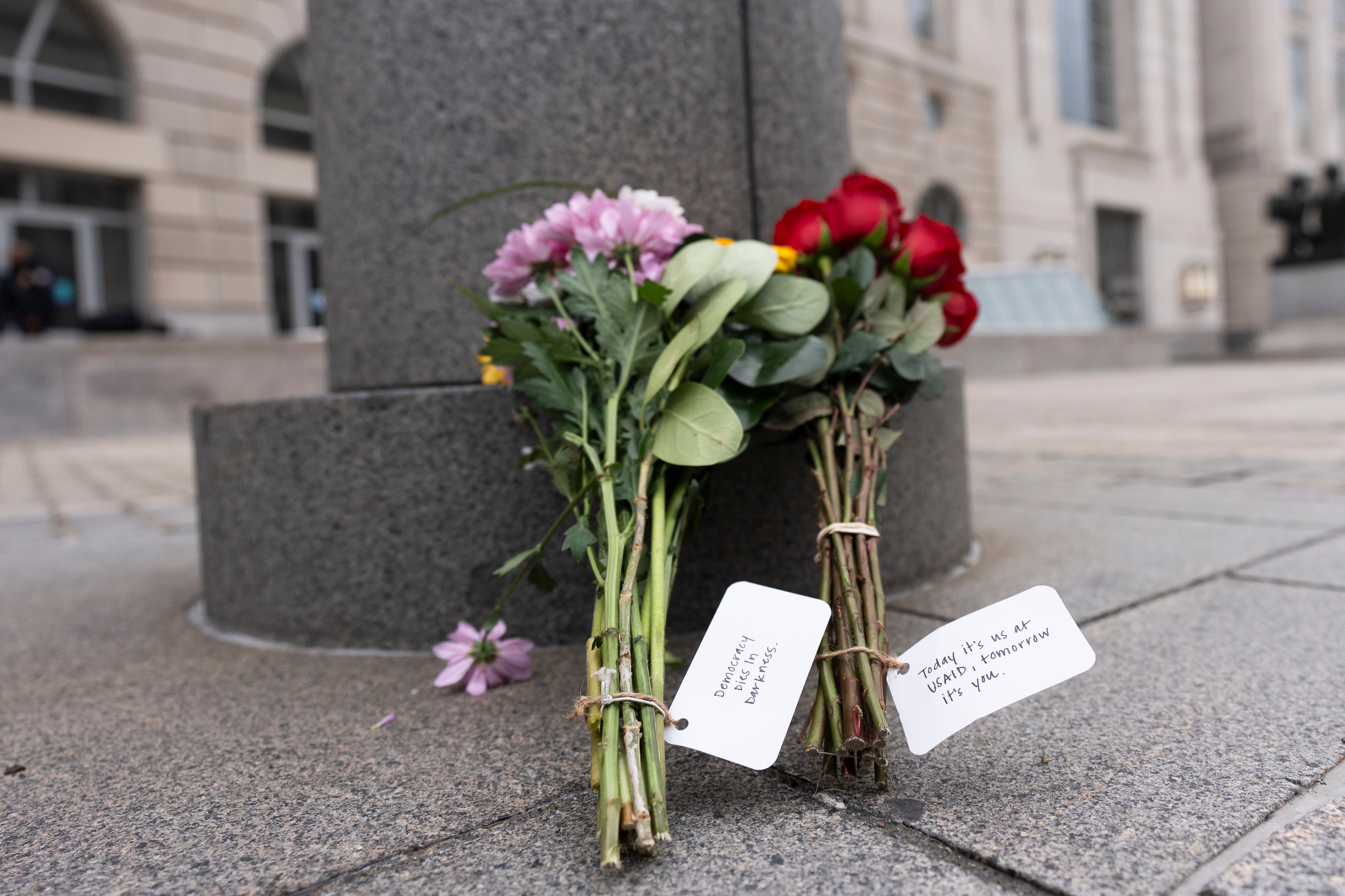 Flowers are left outside the United States Agency for International Development office or USAID office in Washington, D.C.
