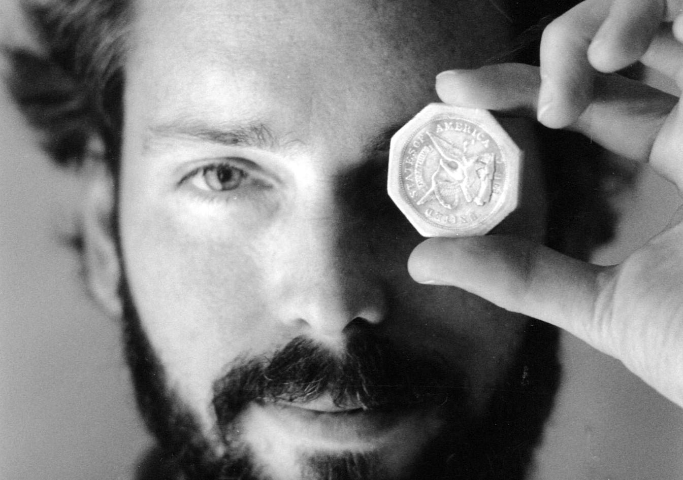 (File Photo) Tommy Thompson holds a $50 pioneer gold piece retrieved from the wreck of the ship S.S. Central America in November 1989