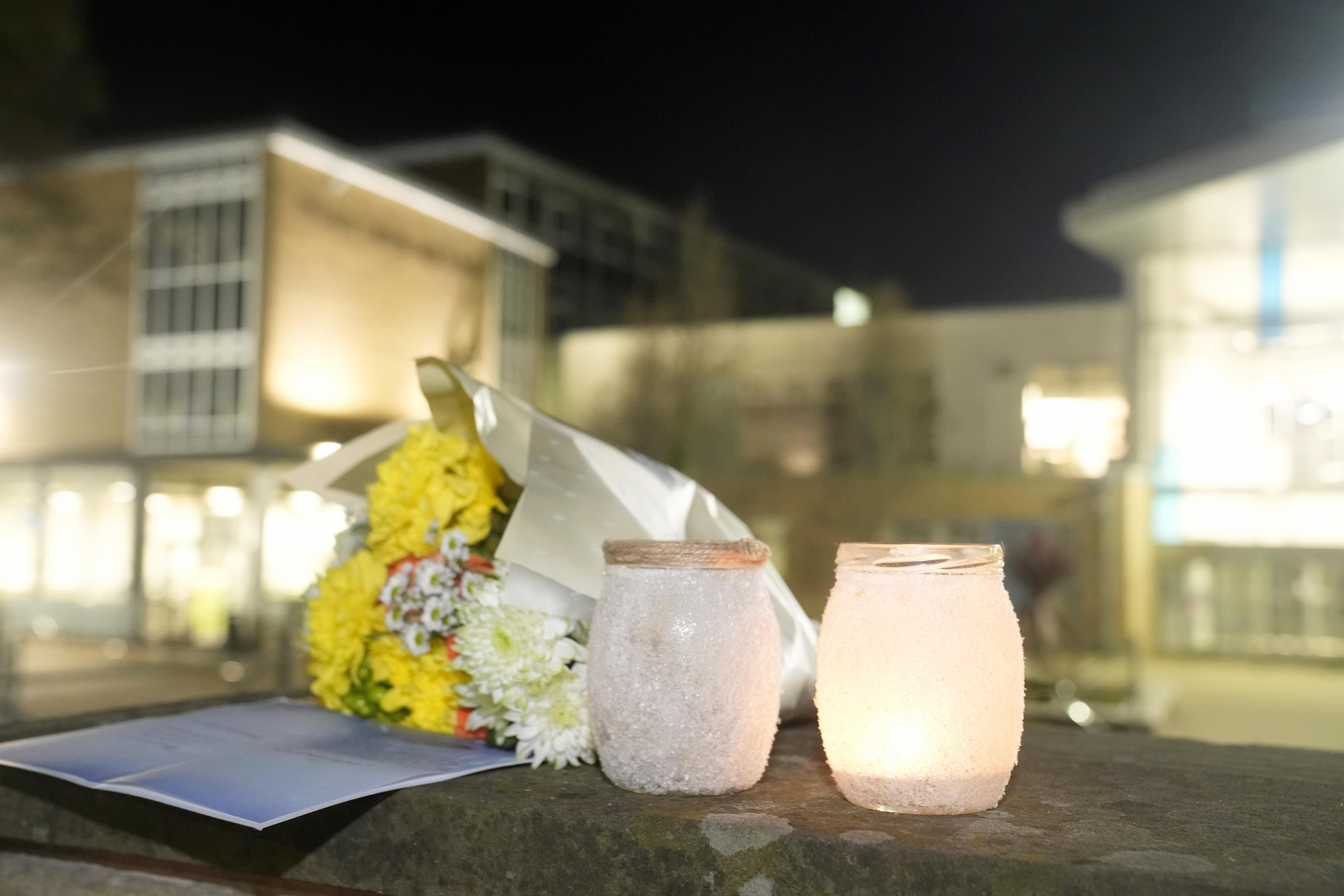 Tributes left outside All Saints Catholic High School (Danny Lawson/PA)