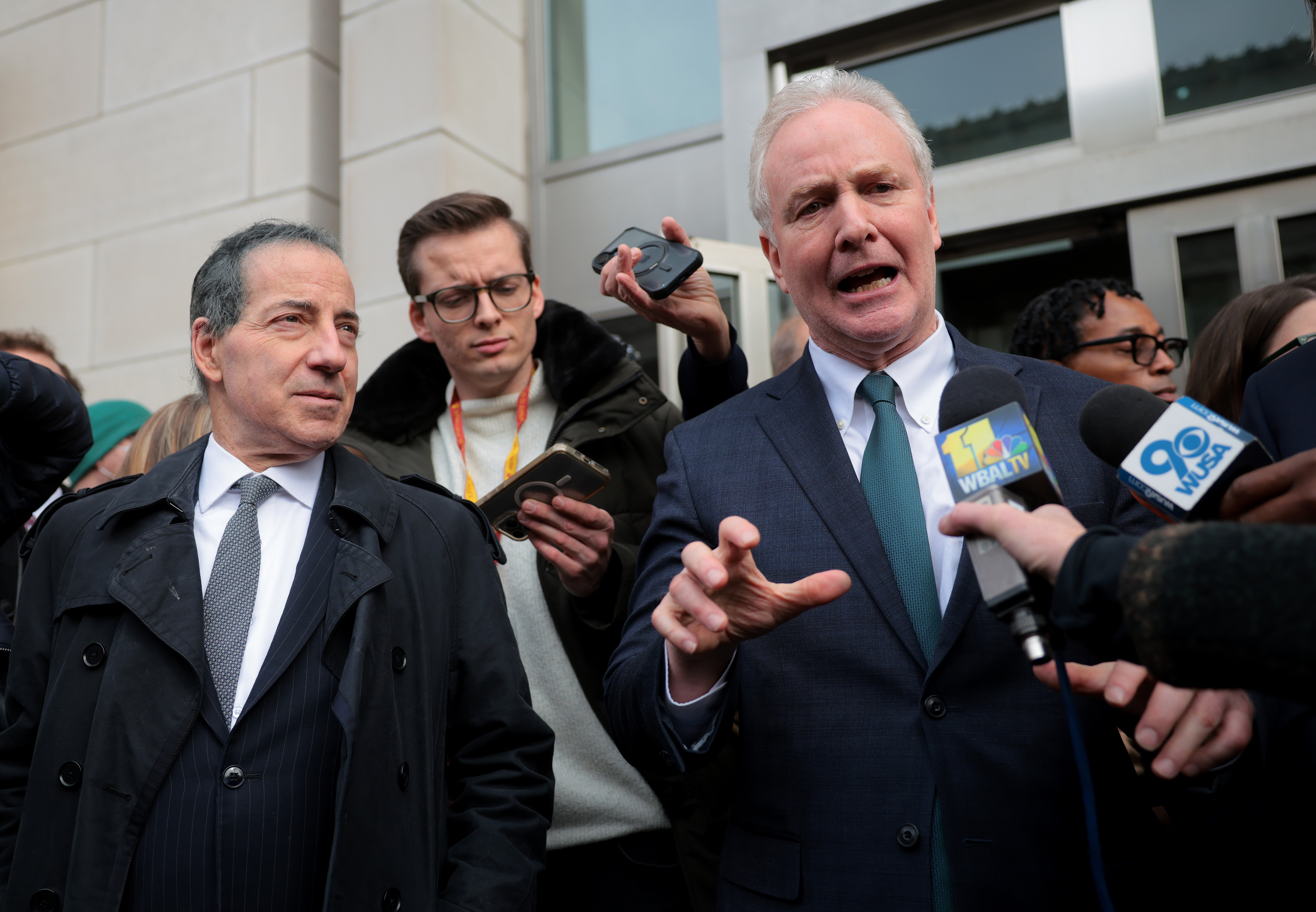 Maryland Democratic Representative Jamie Raskin (left) and Senator Chris Van Hollen (D-Md) speak at a press conference outside of USAID headquarters Monday in Washington, D.C.