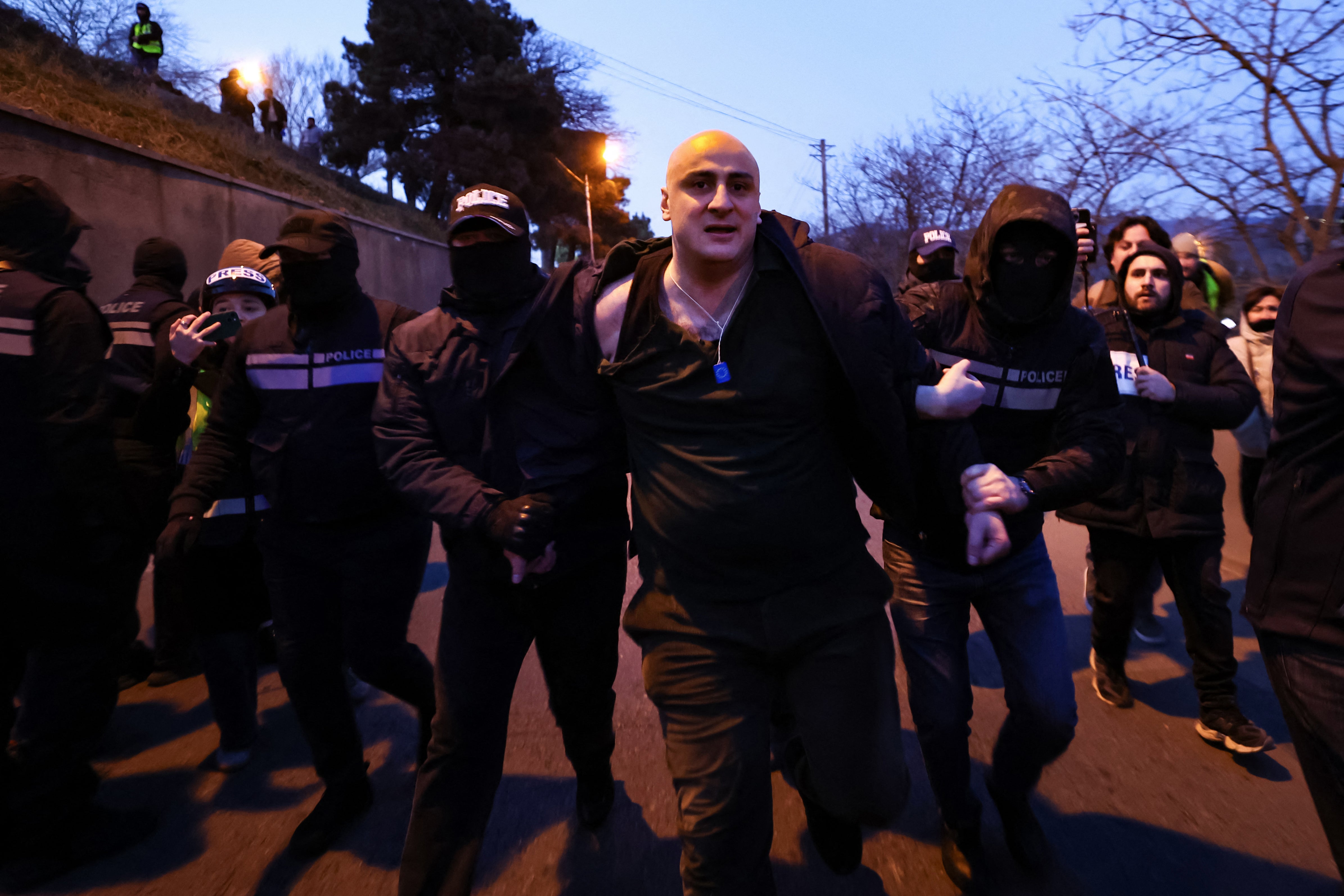 Georgian police detain Nika Melia as anti-government demonstrators attempt to block a highway entrance to the capital Tbilisi on February 2
