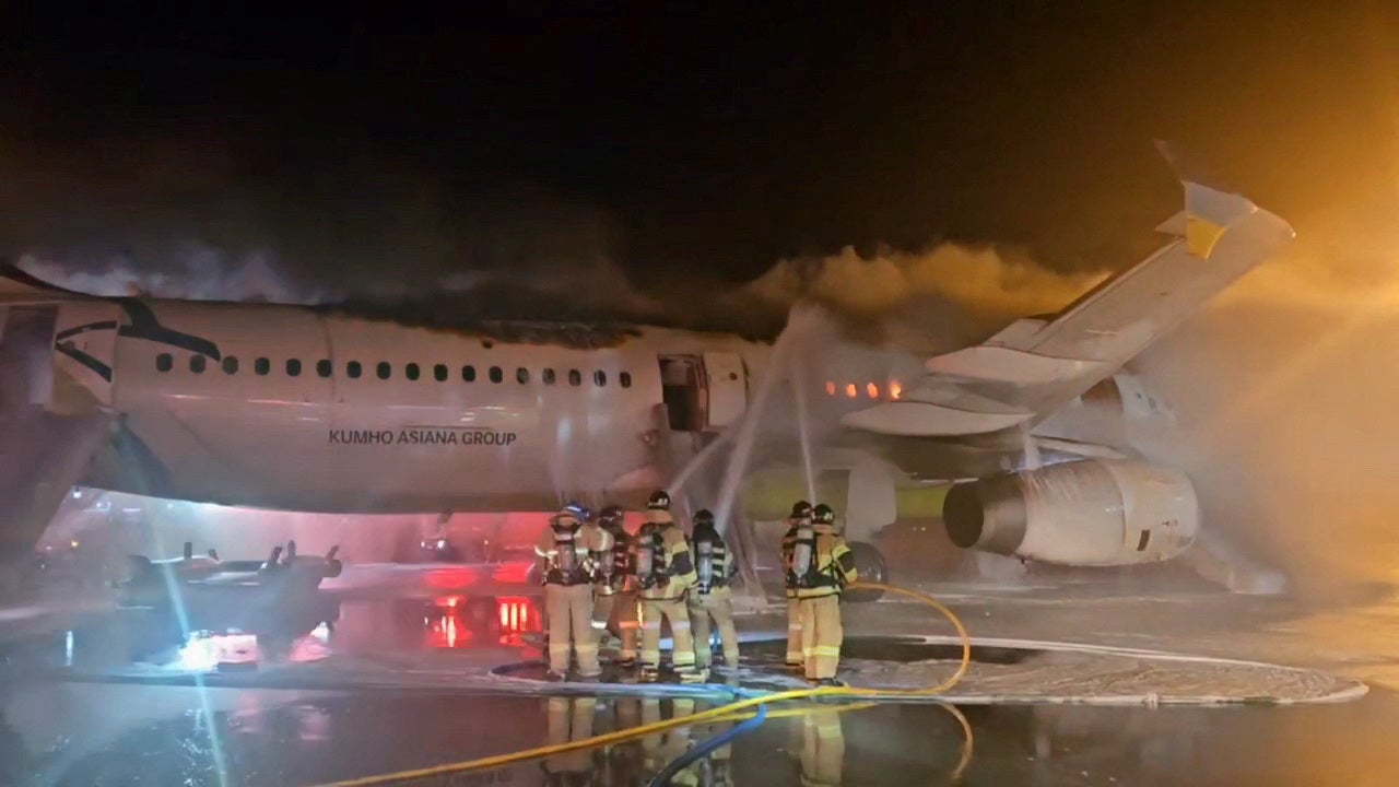 Firefighters try to extinguish the fire from an Air Busan aircraft in Gimhae International Airport in Busan, South Korea, January 28, 2025