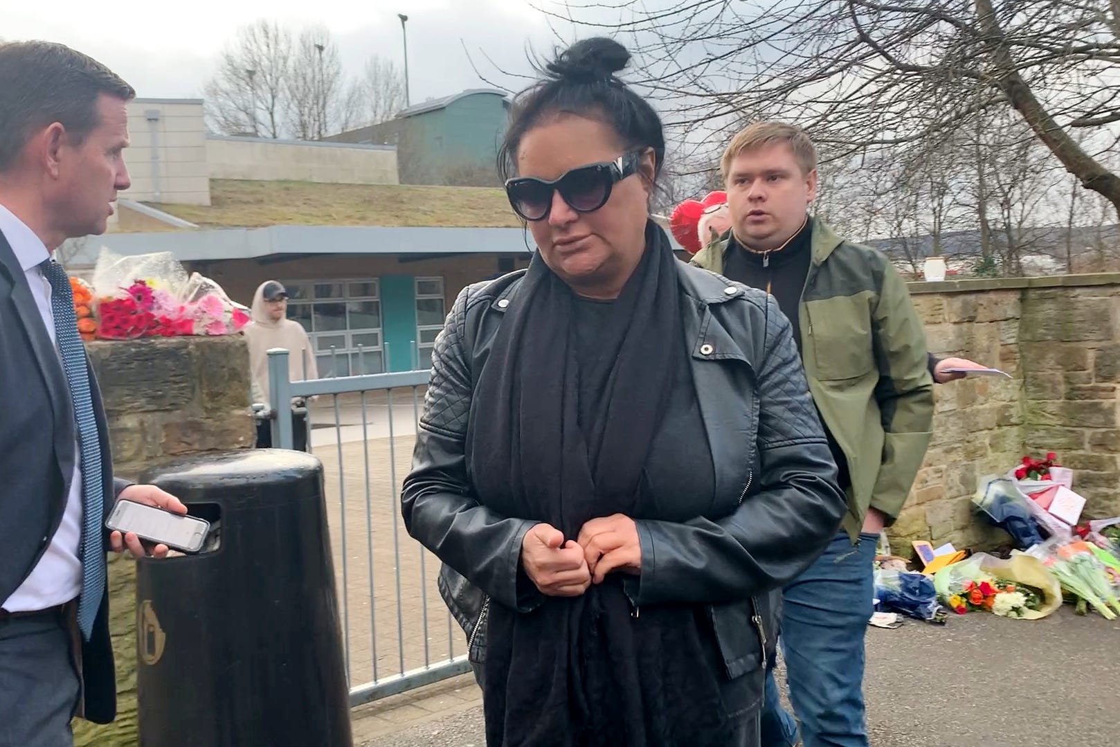 Caroline Willgoose leaving All Saints Catholic High School in Sheffield where her son Harvey was fatally stabbed on Monday (Sophie Robinson/PA)
