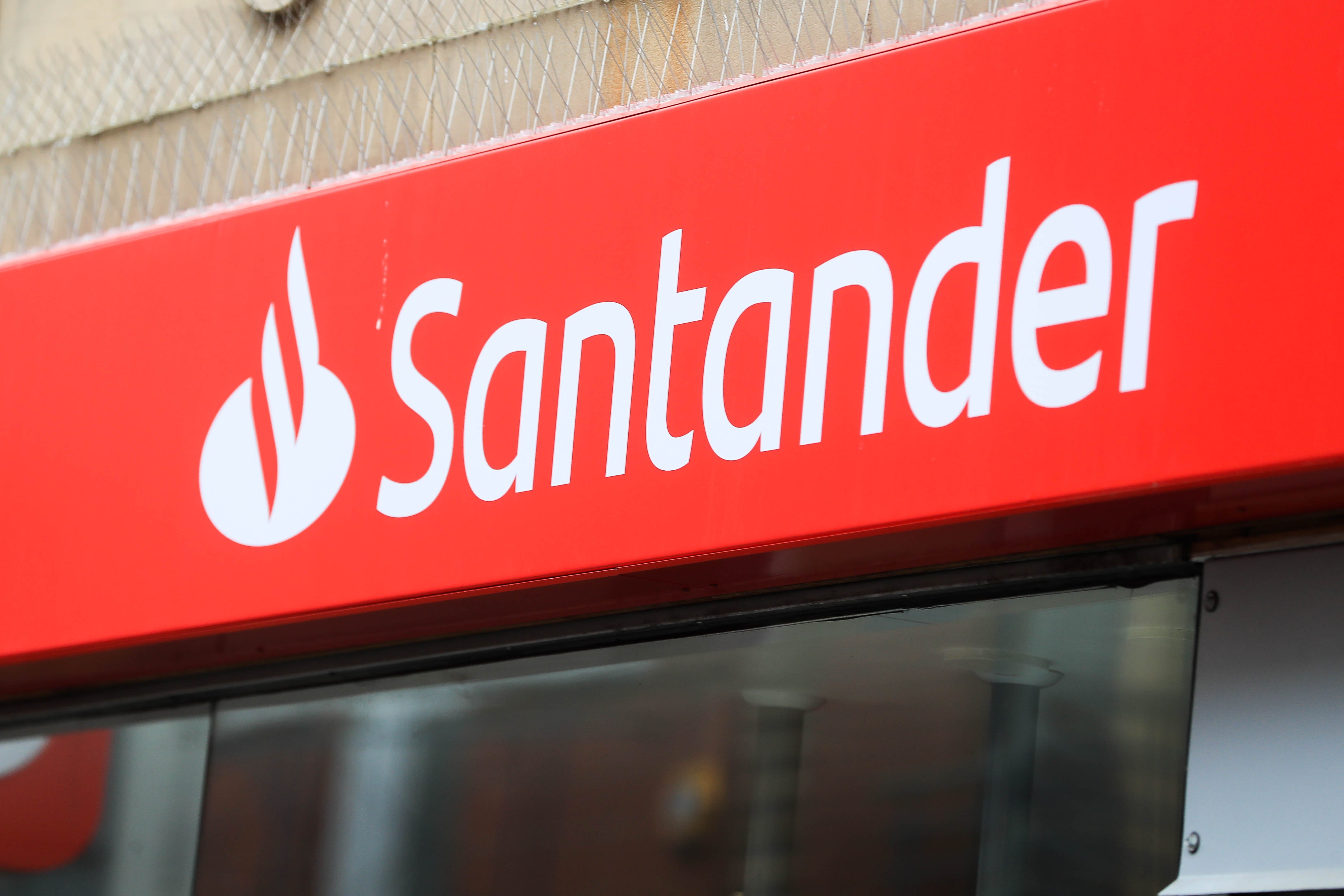 Santander has revealed annual profits tumbled by nearly 40% in the UK as speculation continues to swirl over the future of the British business (PA)