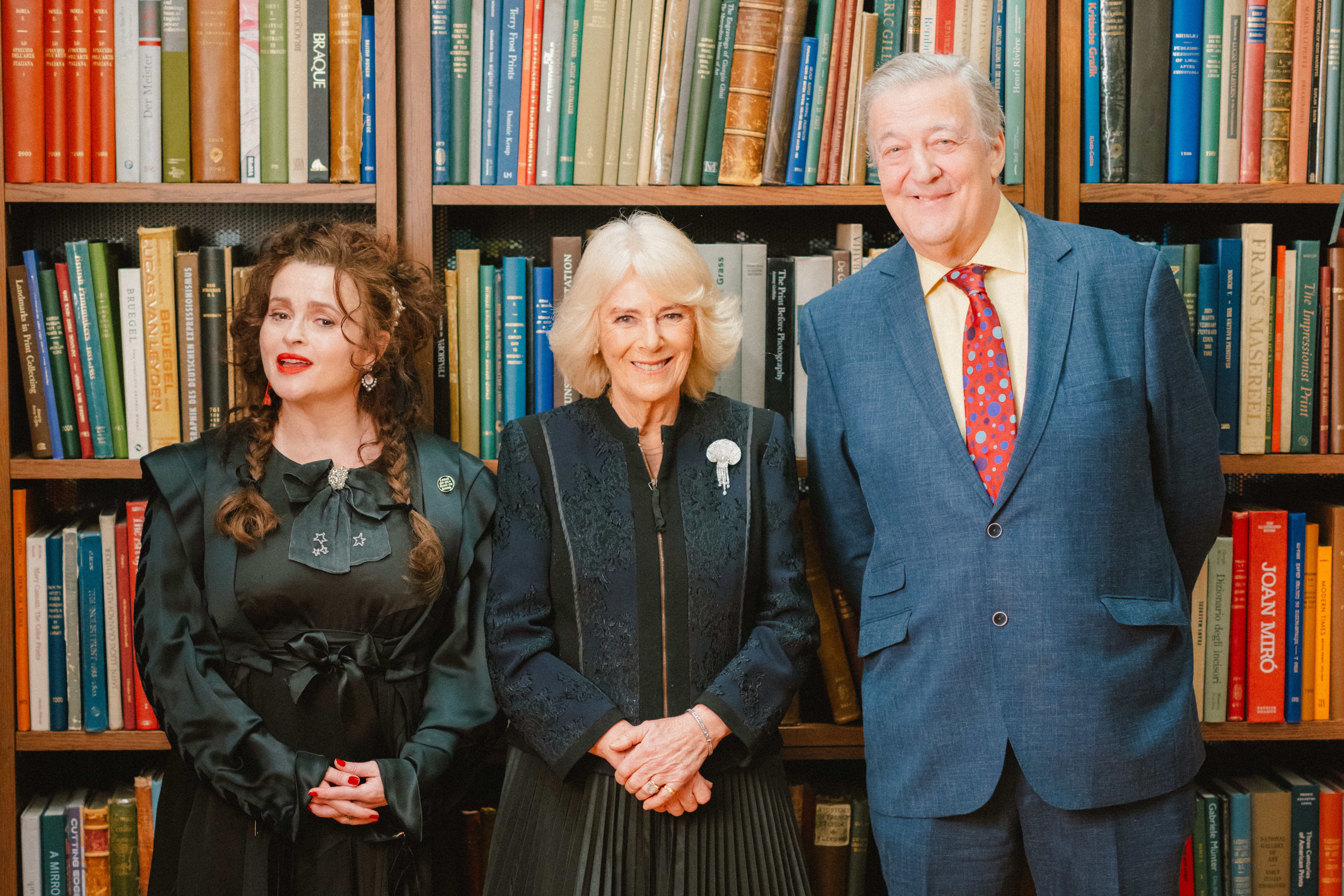 The Queen dined with actress Helena Bonham Carter and presenter and comedian Sir Stephen Fry to celebrate the work of 184-year-old literary institution The London Library (Dale Weeks/PA)