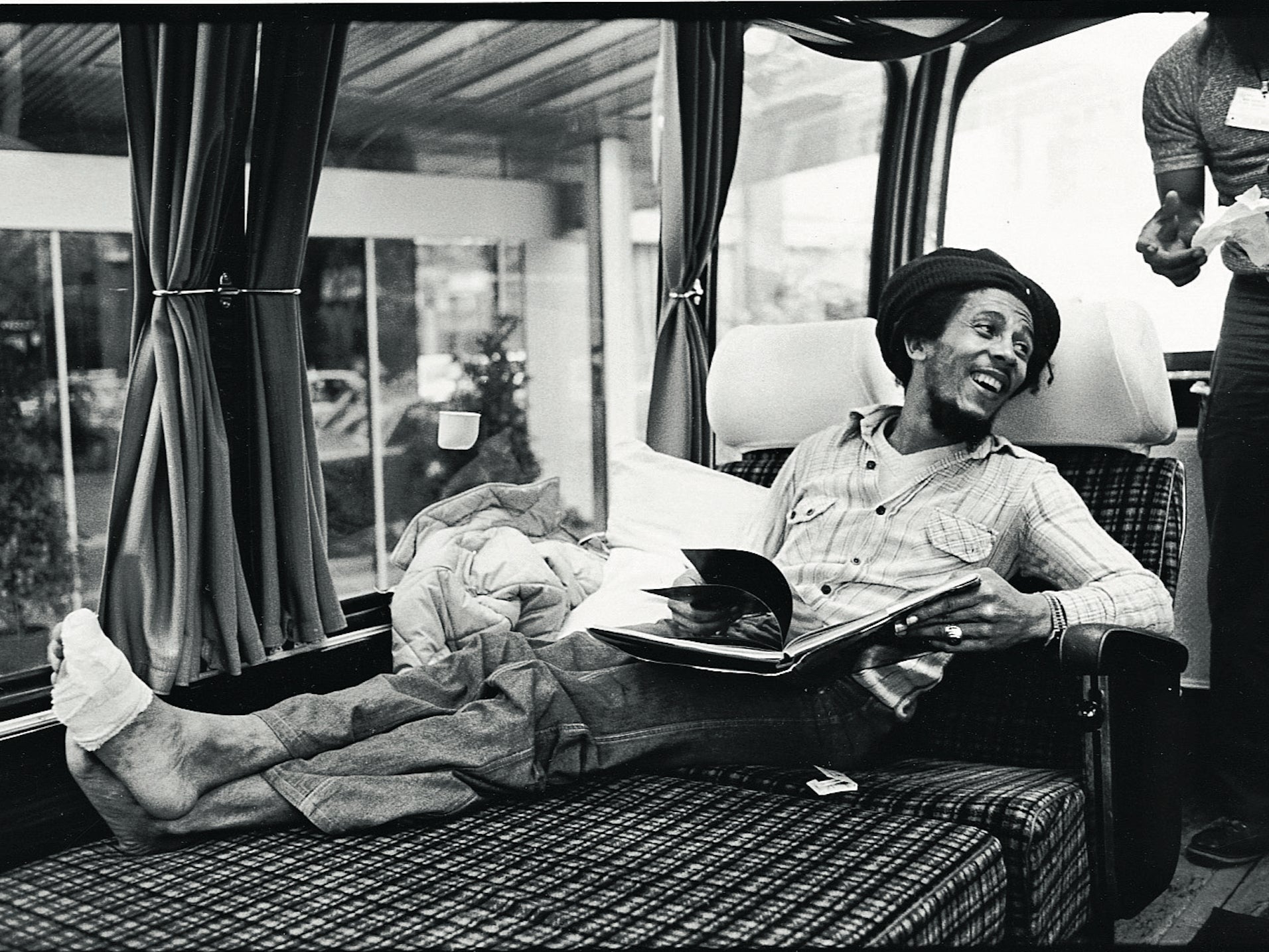 Marley with a bandaged foot on his tour bus