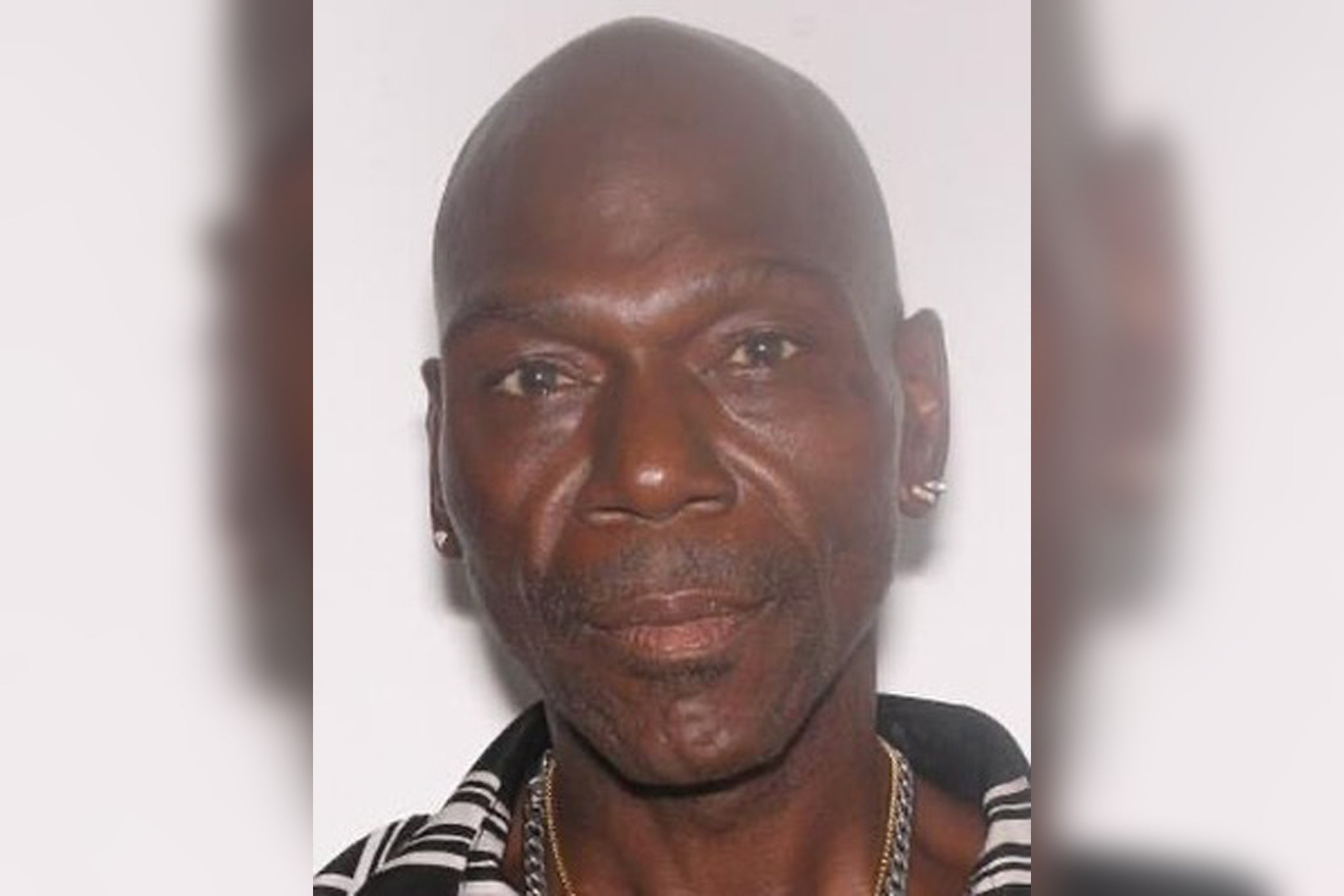 Suspect Ronald Davis is accused of pretending to be a community service officer to carry out a violent attack on Lucy Pat Curl in her Florida home