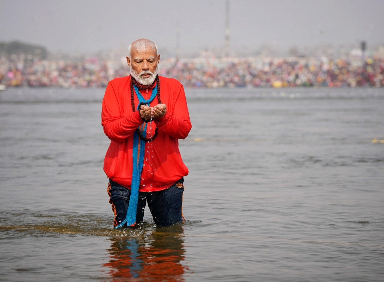 India’s prime minister Narendra Modi prays as he takes a holy dip during the ongoing Maha Kumbh Mela