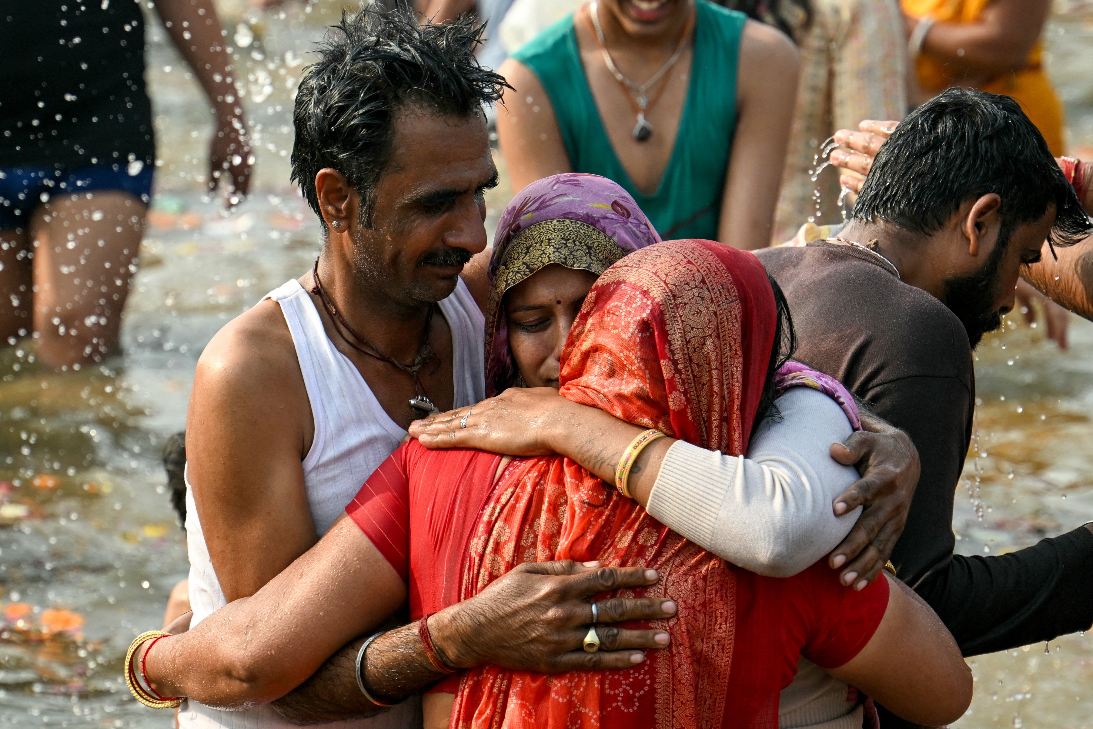 Hindu pilgrims take a holy dip at Sangam