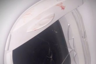 A combative passenger aboard a Frontier airlines flight to Houston allegedly broke a window on the plane in a violent outburst on Wednesday, passengers said