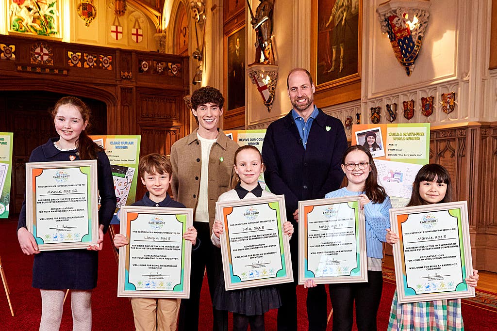 Blue Peter presenter Joel Mawhinney and Prince William with the prize winners (BBC/PA)