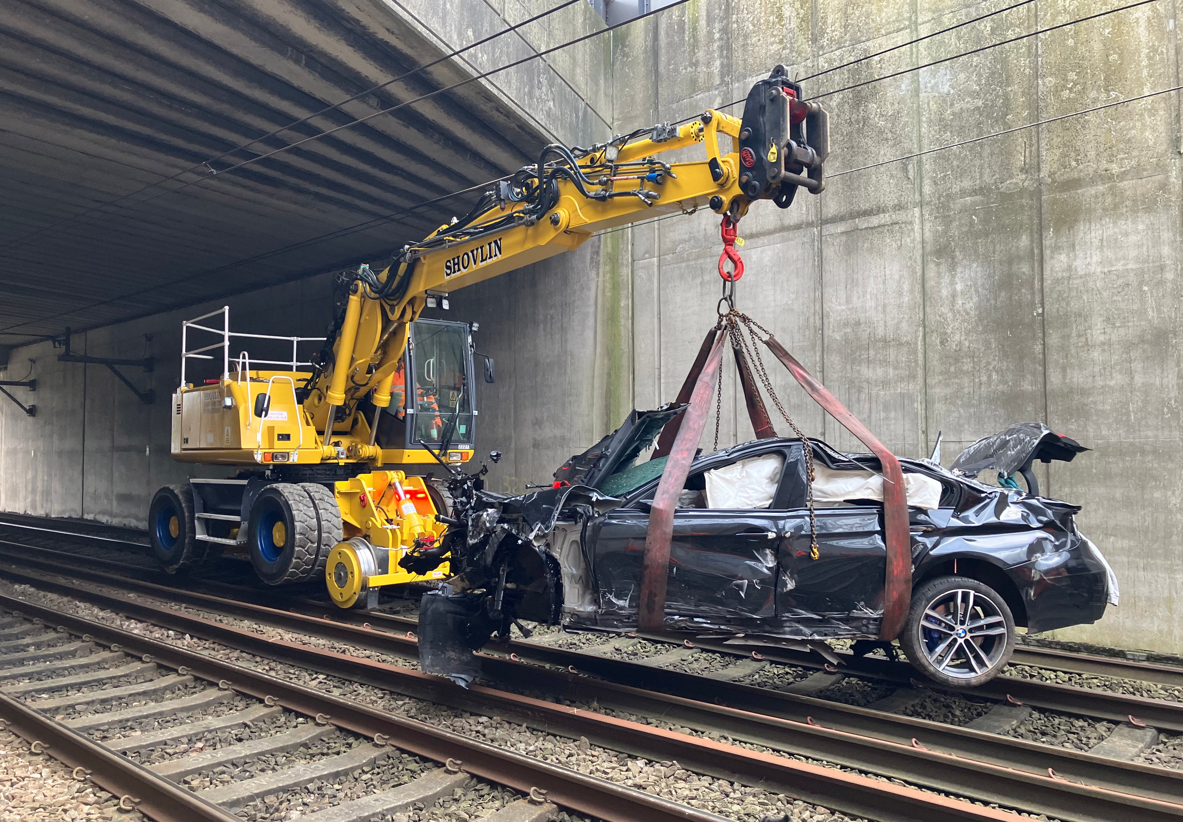 The car was removed from the tracks by emergency workers