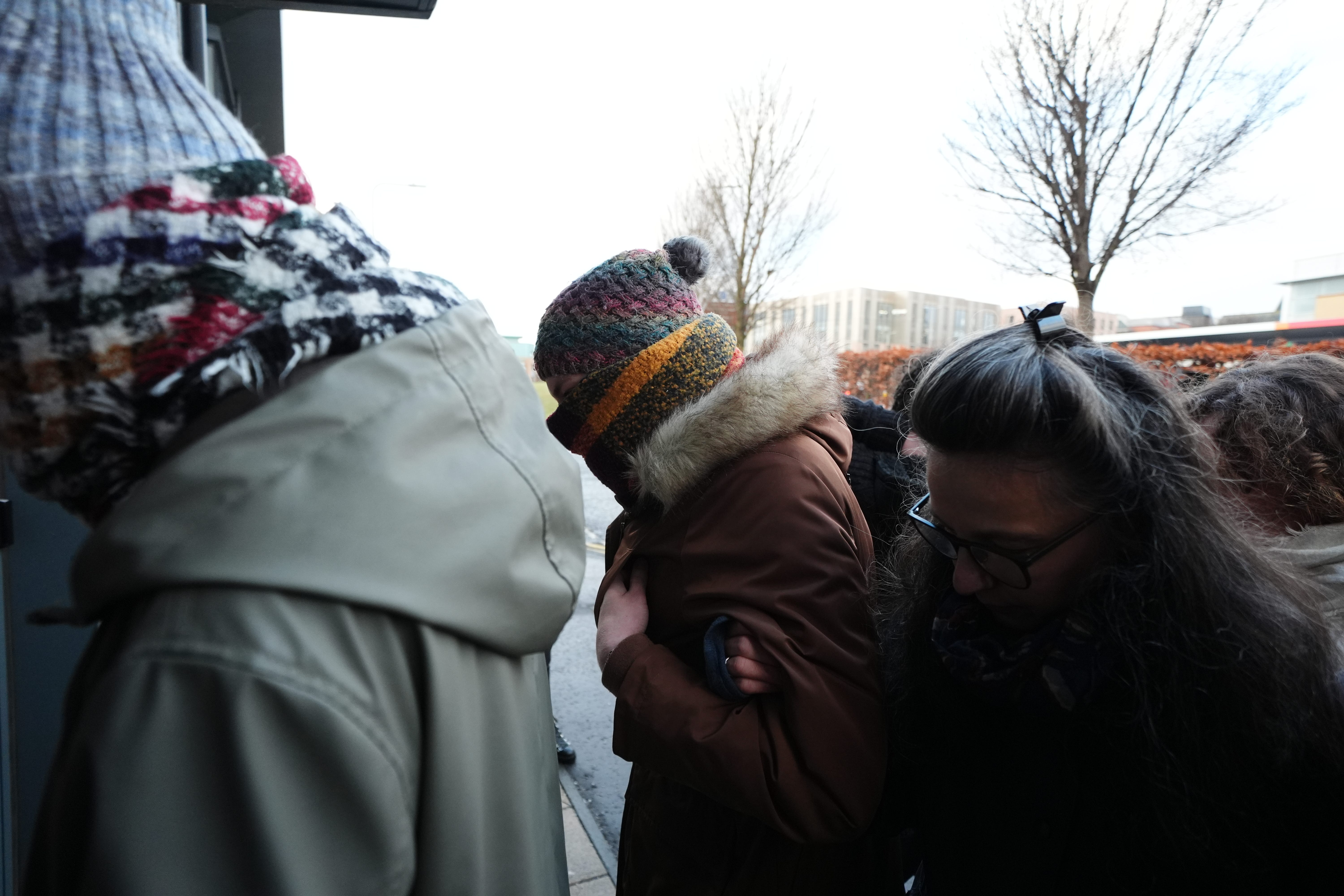 Dr Beth Upton (centre) arrives at an employment tribunal in Dundee (Andrew Milligan/PA)