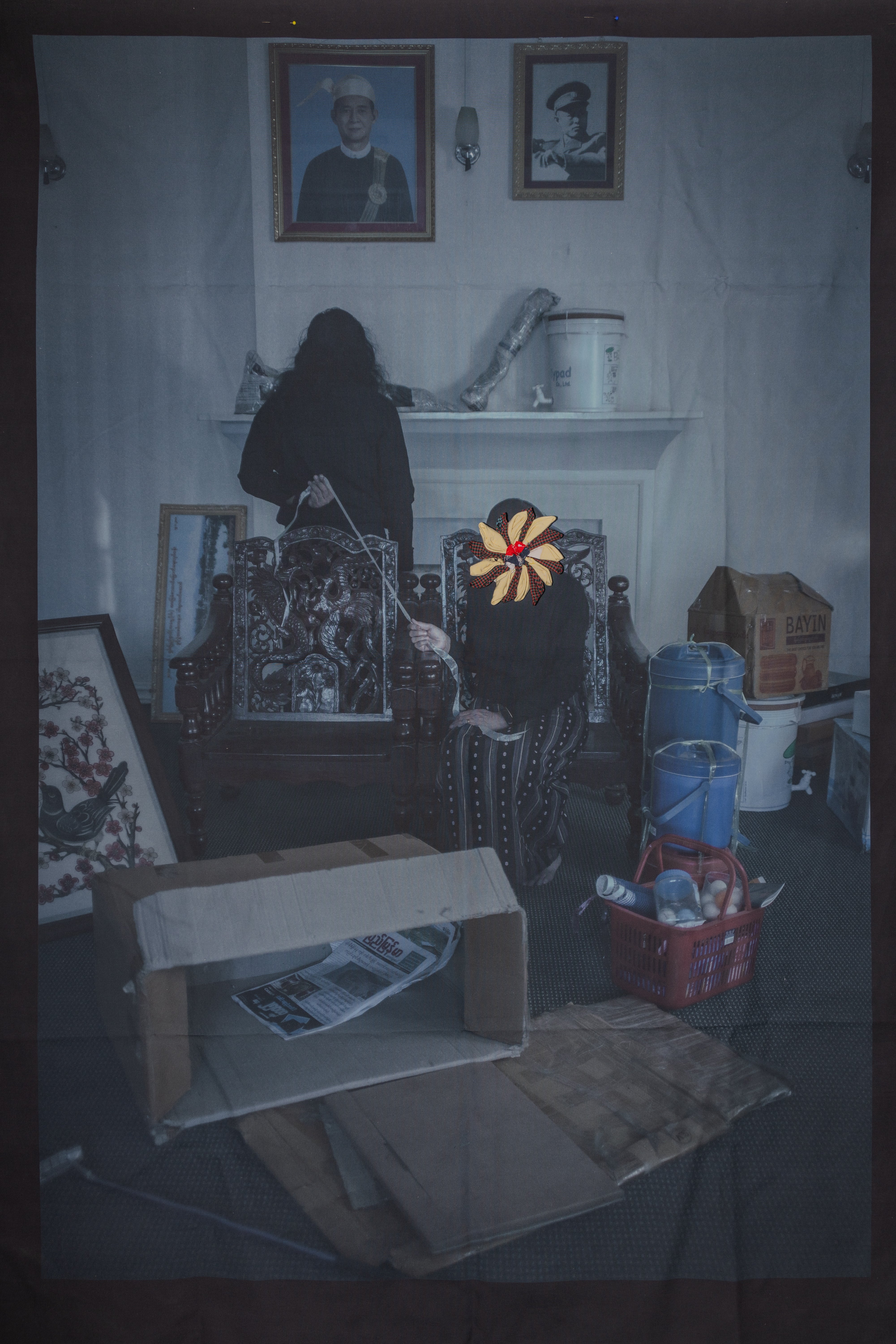 Sai and his mother at their home after the arrest of Sai’s father