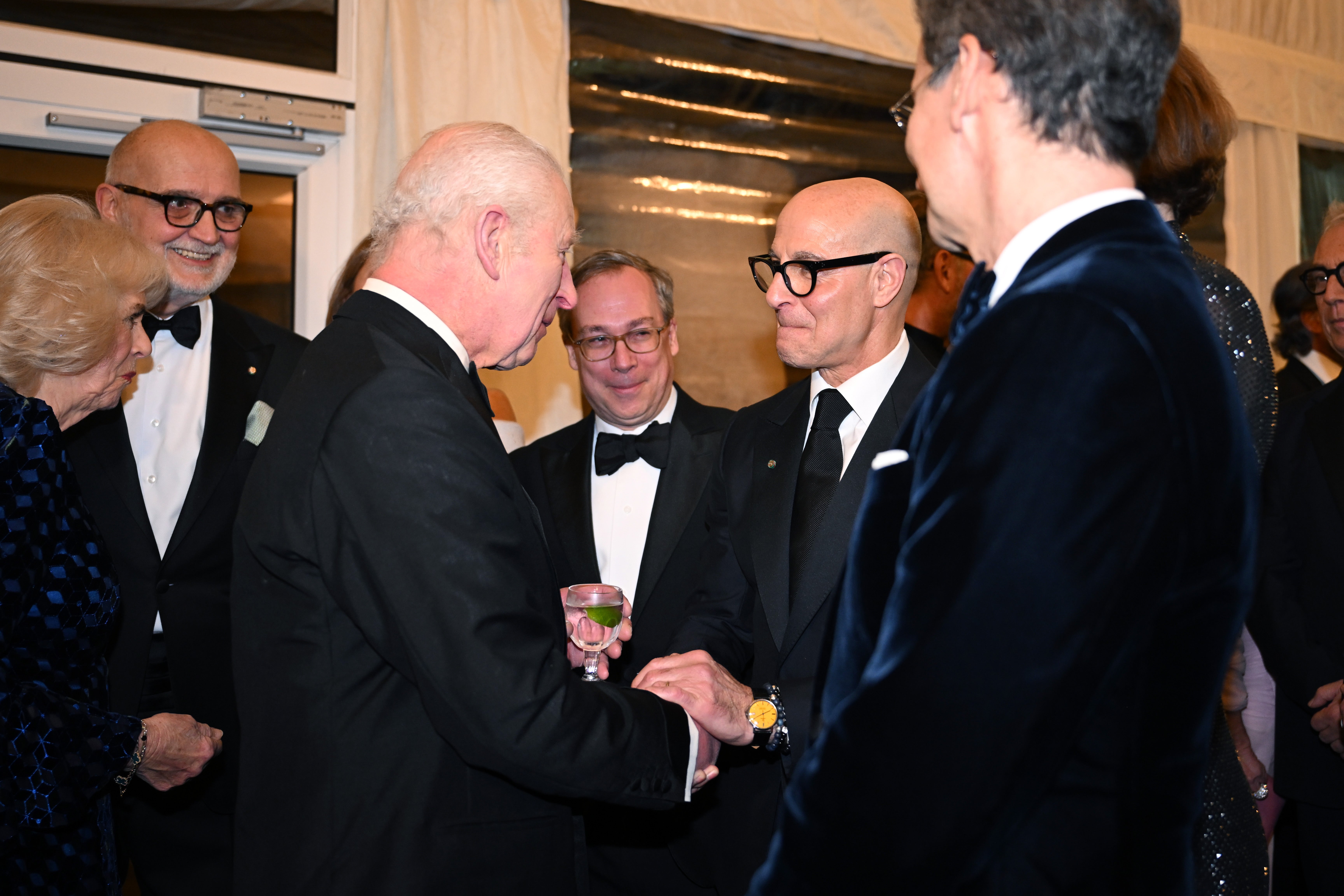 King Charles and Stanley Tucci engaged in conversation