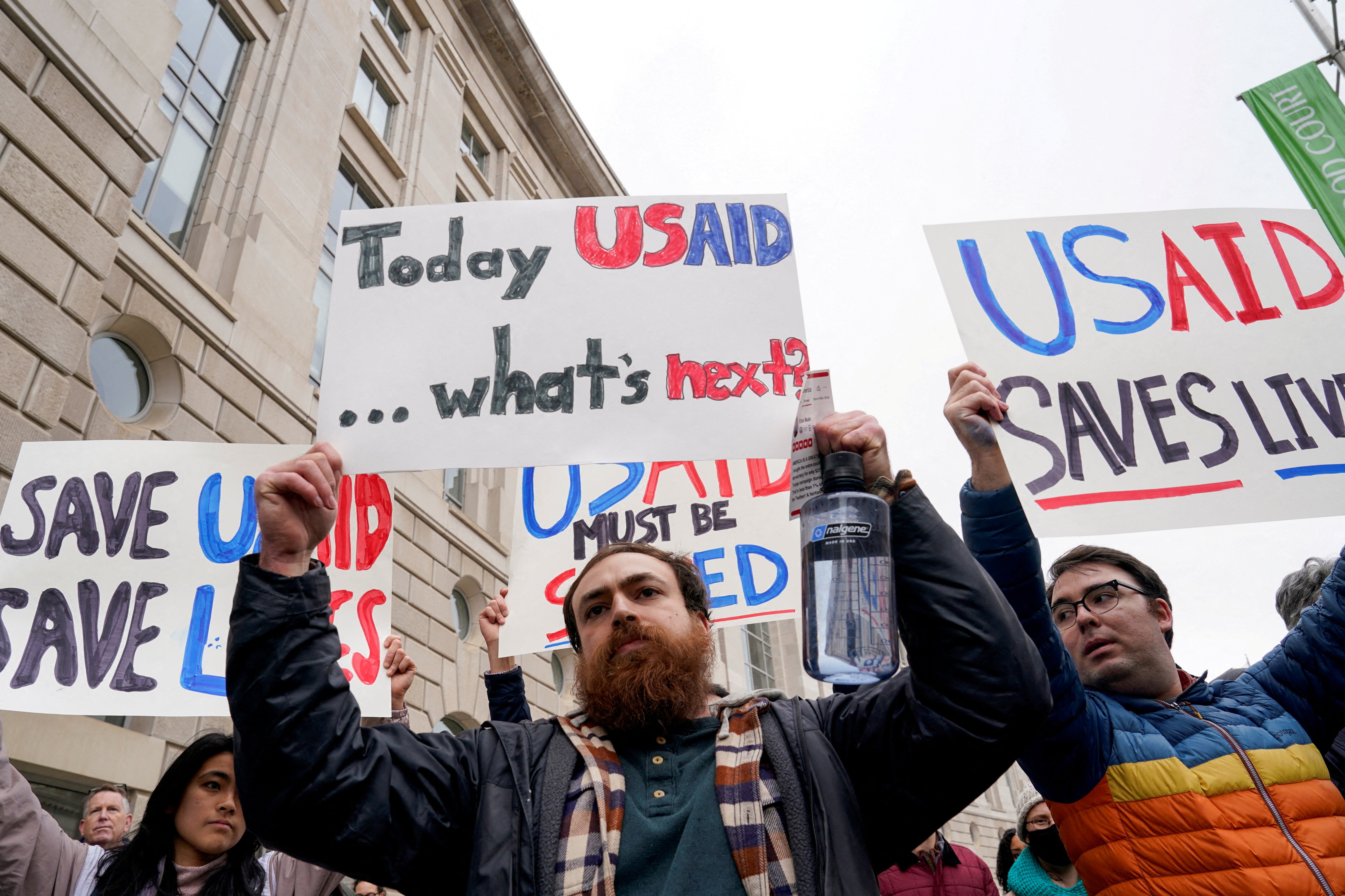 Demonstrators protest Trump and Musk-led cuts to USAID outside the aid agency’s headquarters in Washington on February 3