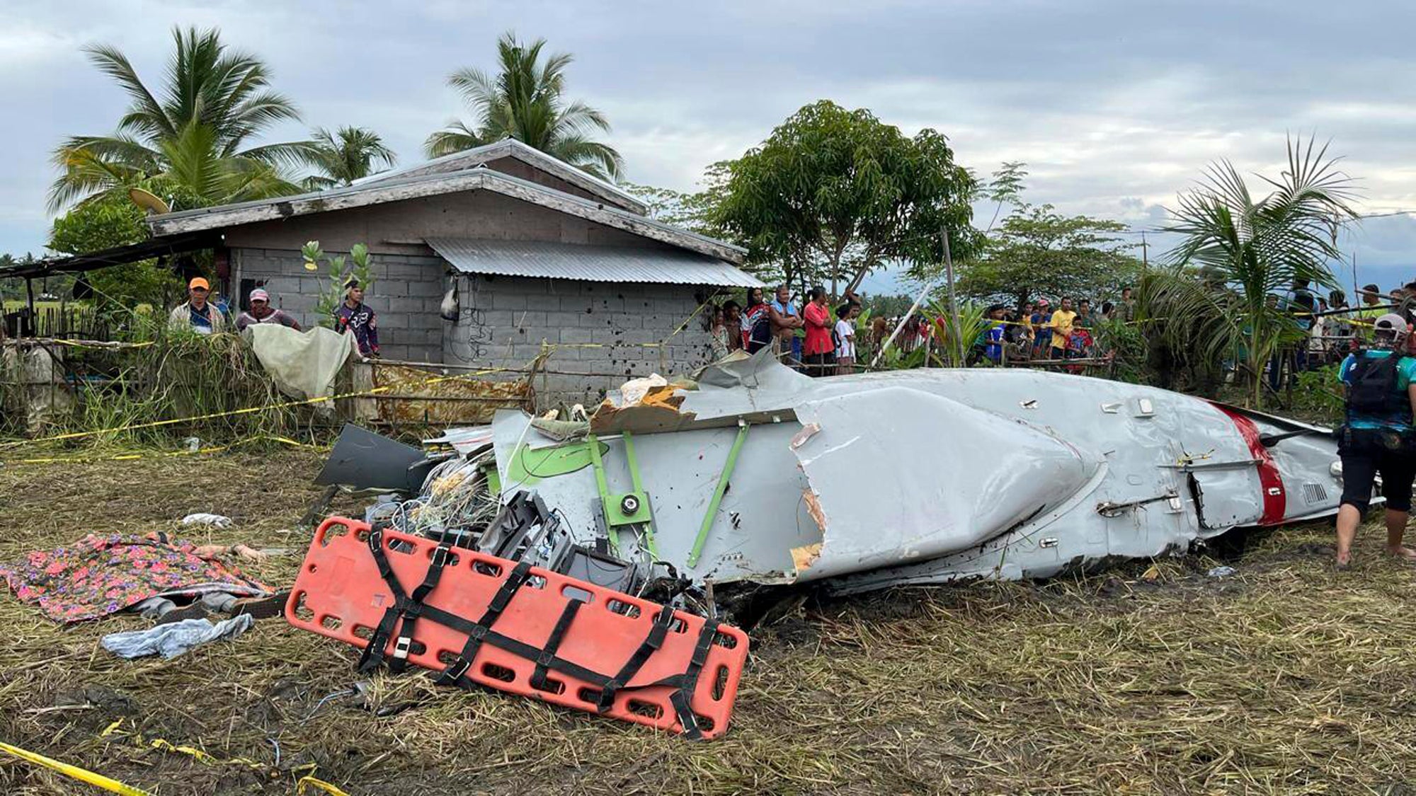 Wreckage of airplane in a rice field in Maguindanao del Sur province, Philippines, after officials say a US military-contracted plane crashed