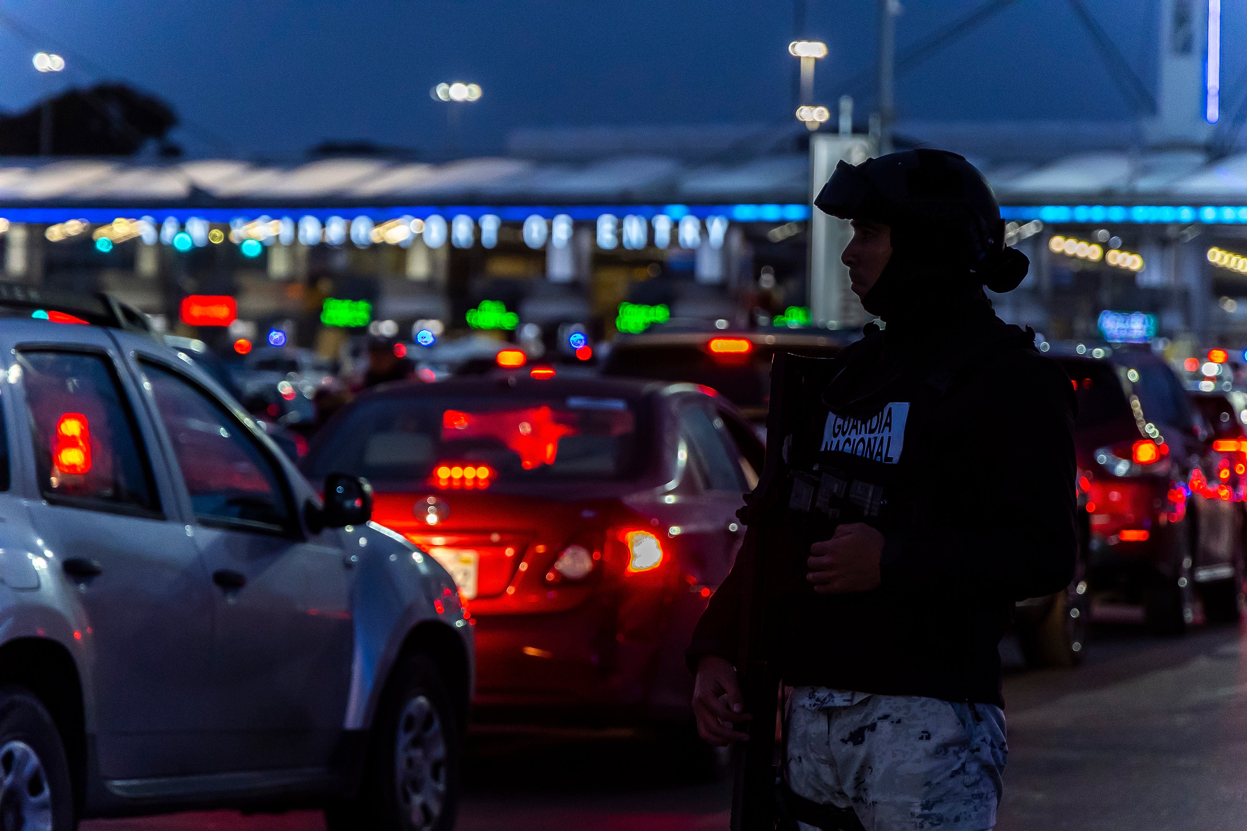 National Guard officers install a checkpoint to inspect motorists before crossing into the United States at San Ysidro Port of Entry on February 6, 2025 in Tijuana, Mexico.