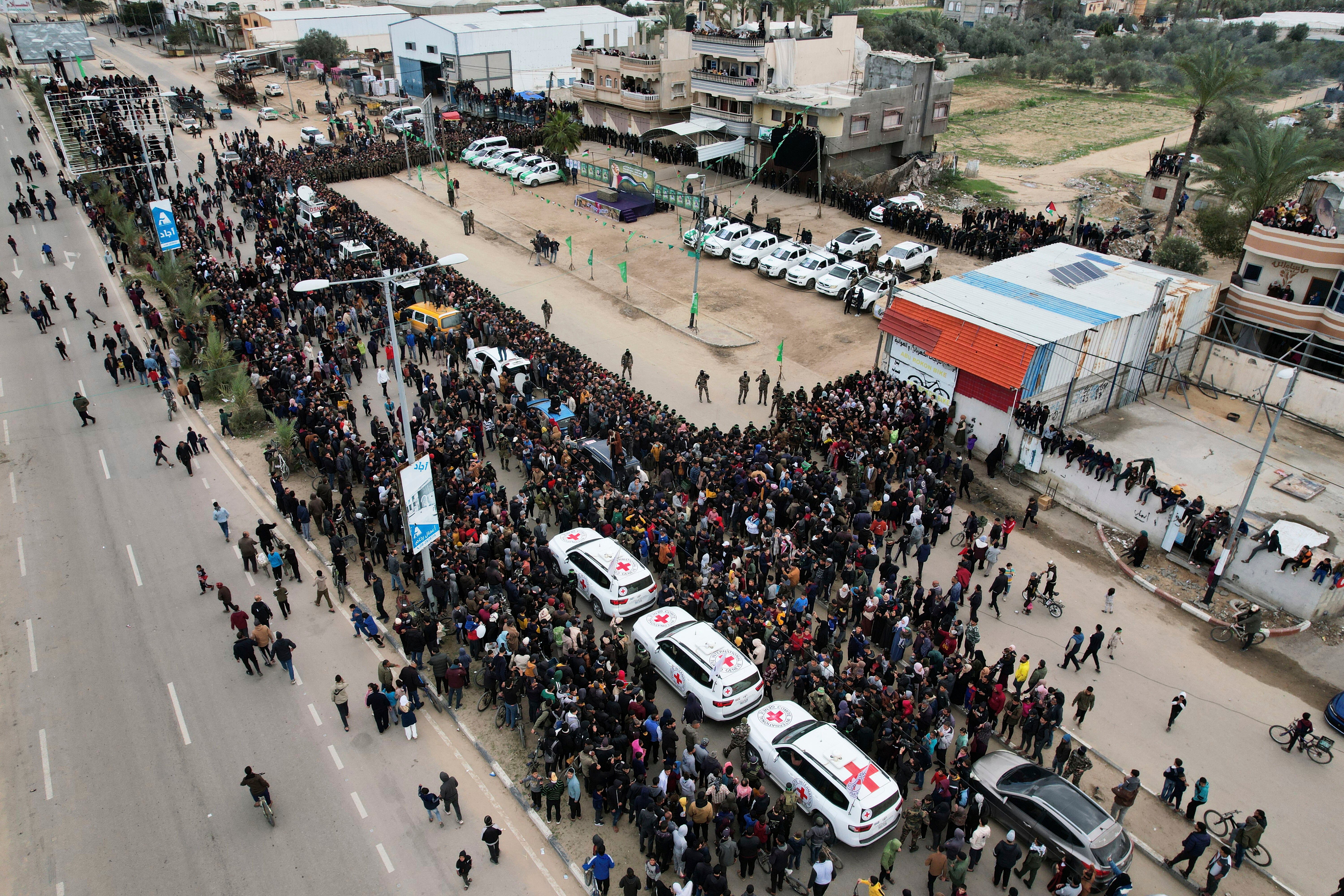 International Red Cross cars wait for Israeli captives on Saturday