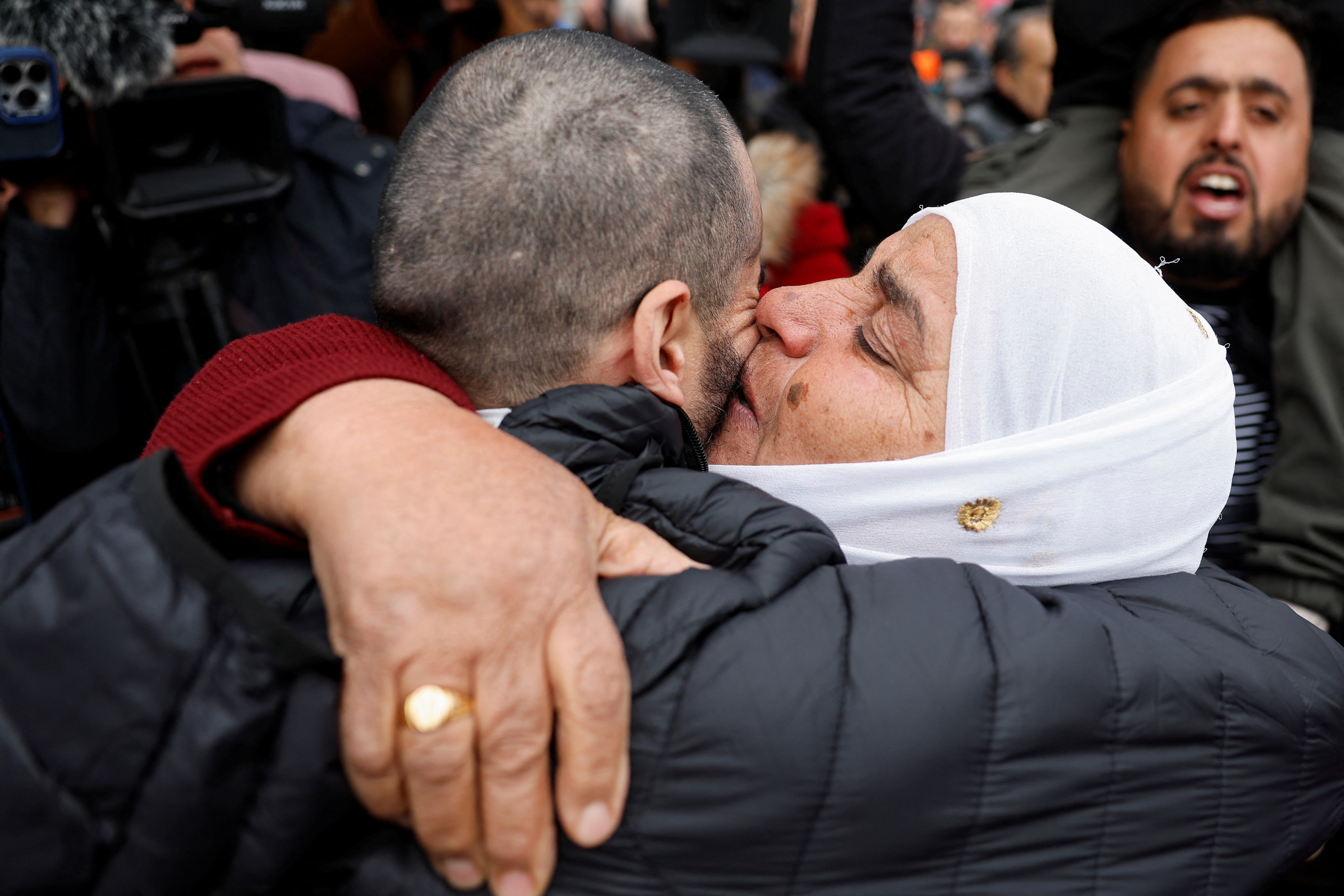 A freed Palestinian prisoner is hugged after being released