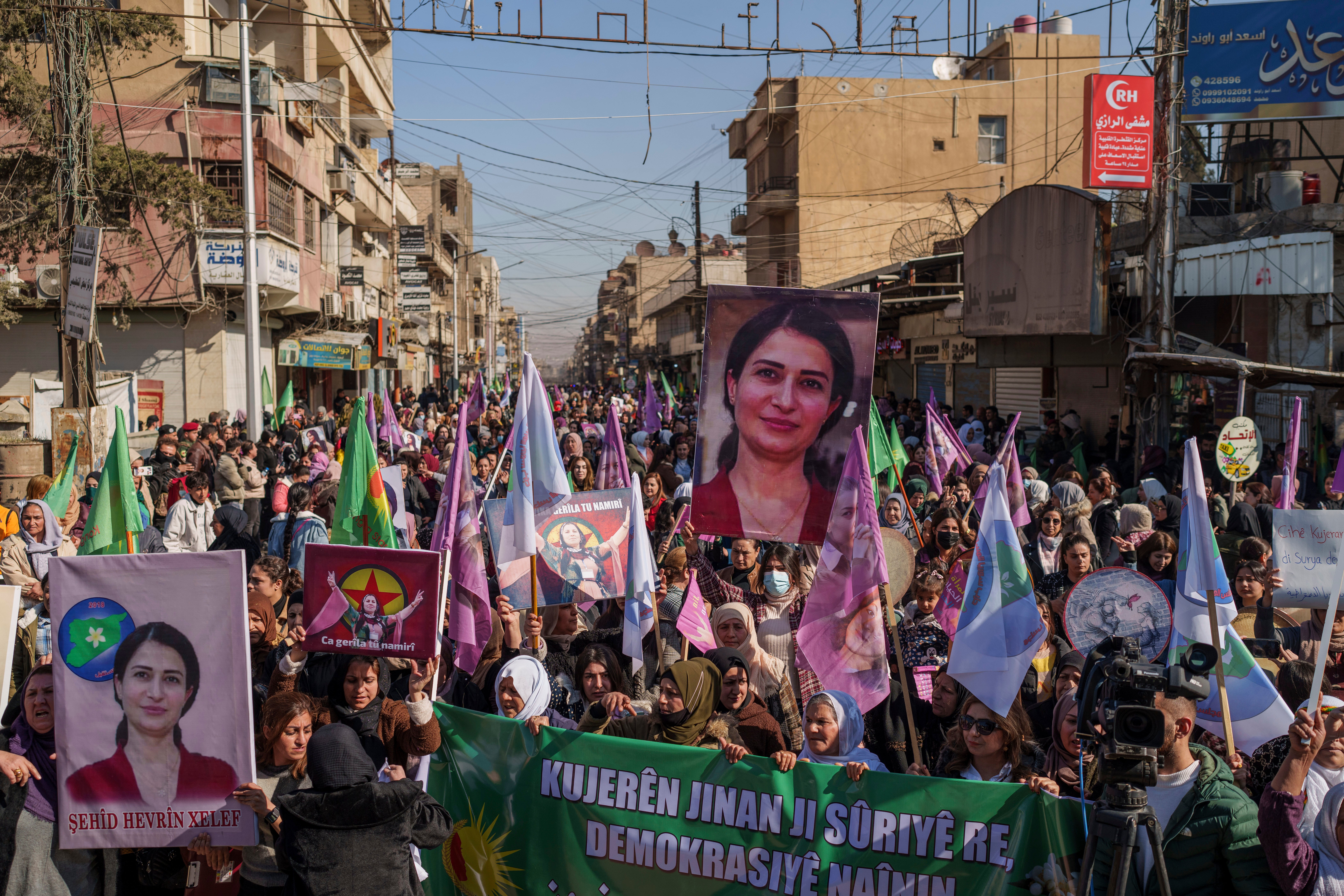 Women march during a rally to mark the 2019 killing of Kurdish politician Hevreen Khalaf