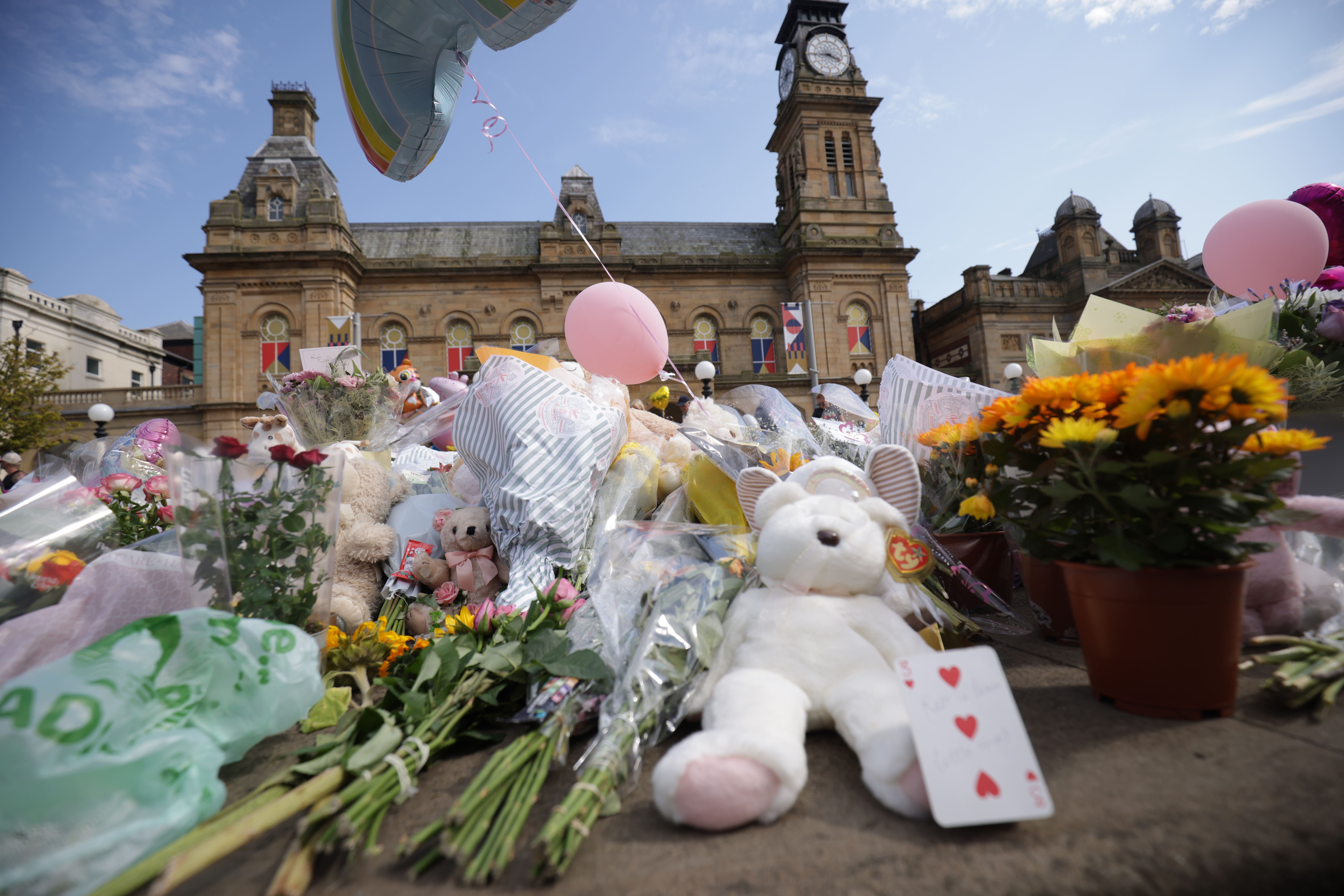 Flowers and tributes outside the Atkinson Art Centre Southport in tribute to the victims (PA)