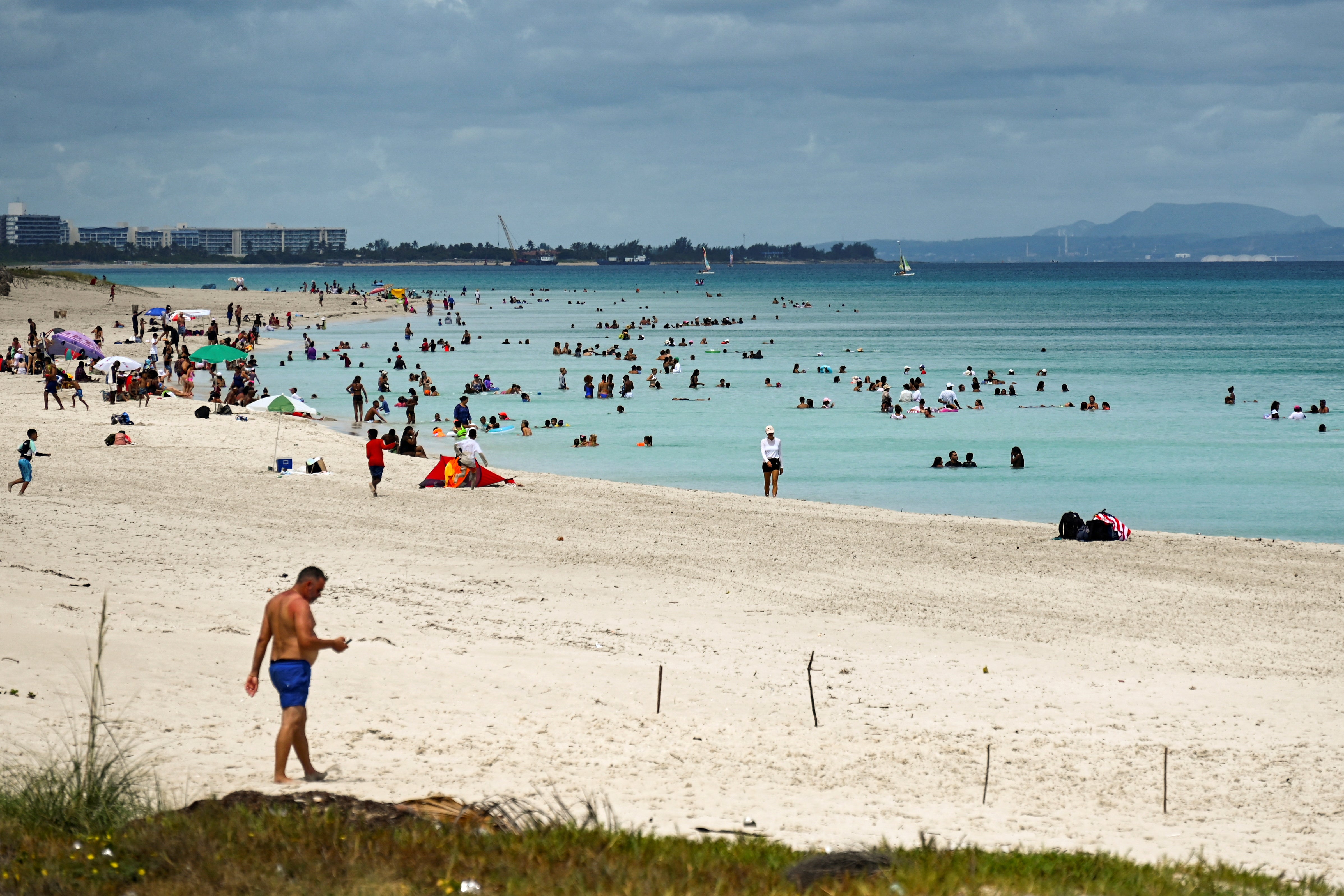 Tourists enjoy the day at Varadero Beach, Matanzas Province, Cuba, on June 8, 2024. A Tsunami alert was issued for the island but later withdrawn