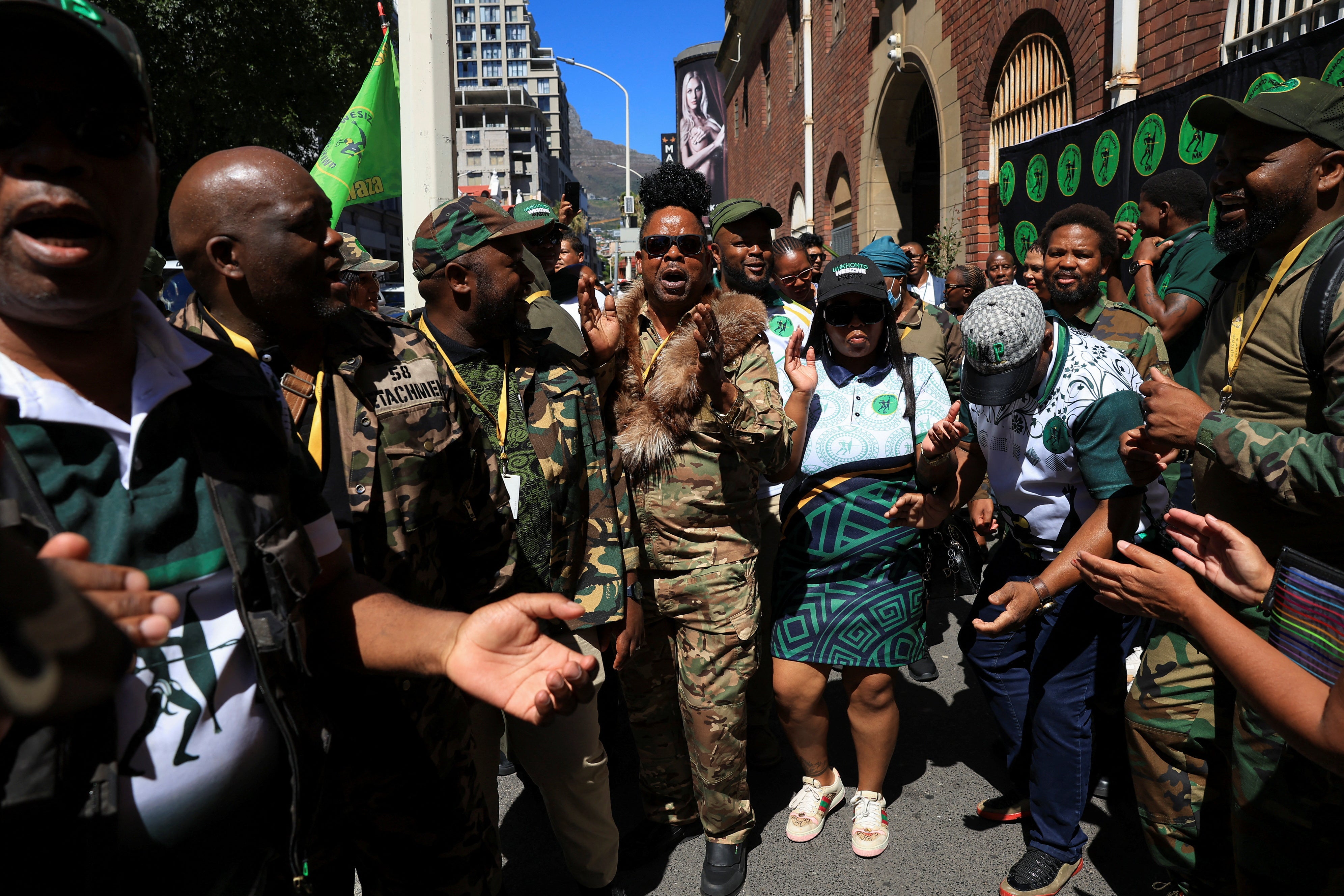 Former South African president Jacob Zuma's uMkhonto (MK) party members gather in front of Cape Town Central police station where the MK party opened a treason case against AfriForum