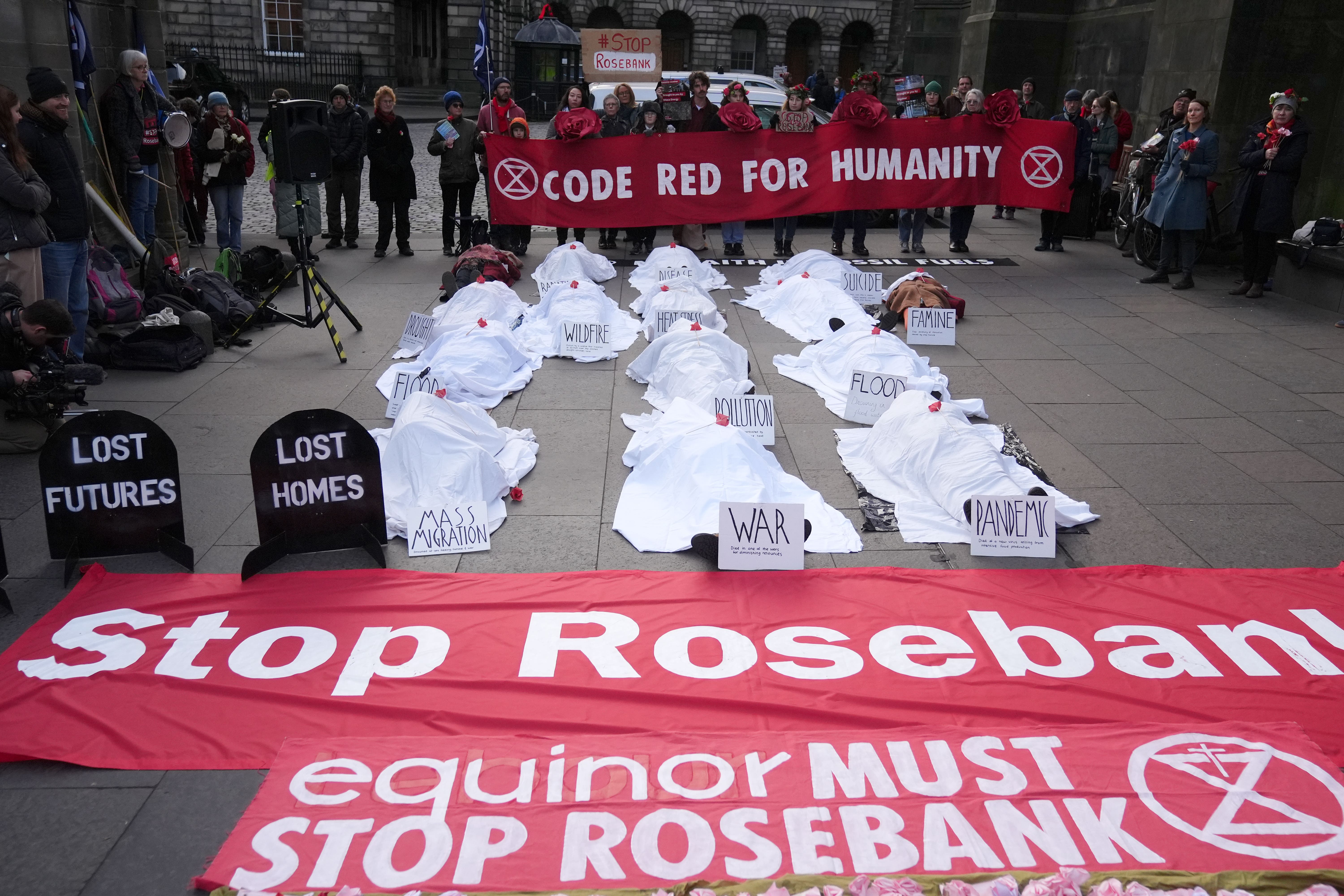Climate activists from Greenpeace and Uplift during a demonstration outside the Scottish Court of Session (Andrew Milligan/PA)