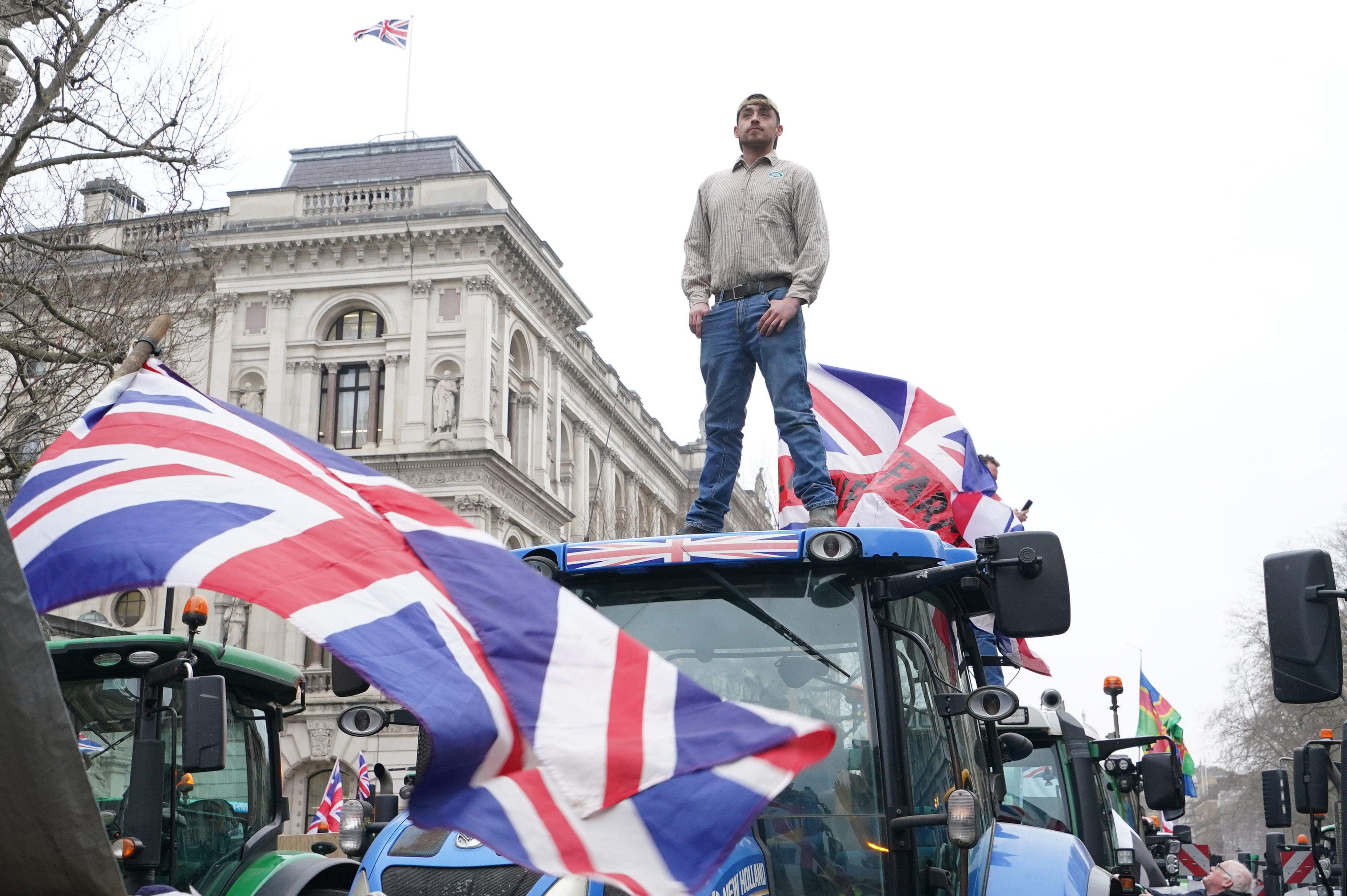 Farmers and their tractors protest in Whitehall (Gareth Fuller/PA)
