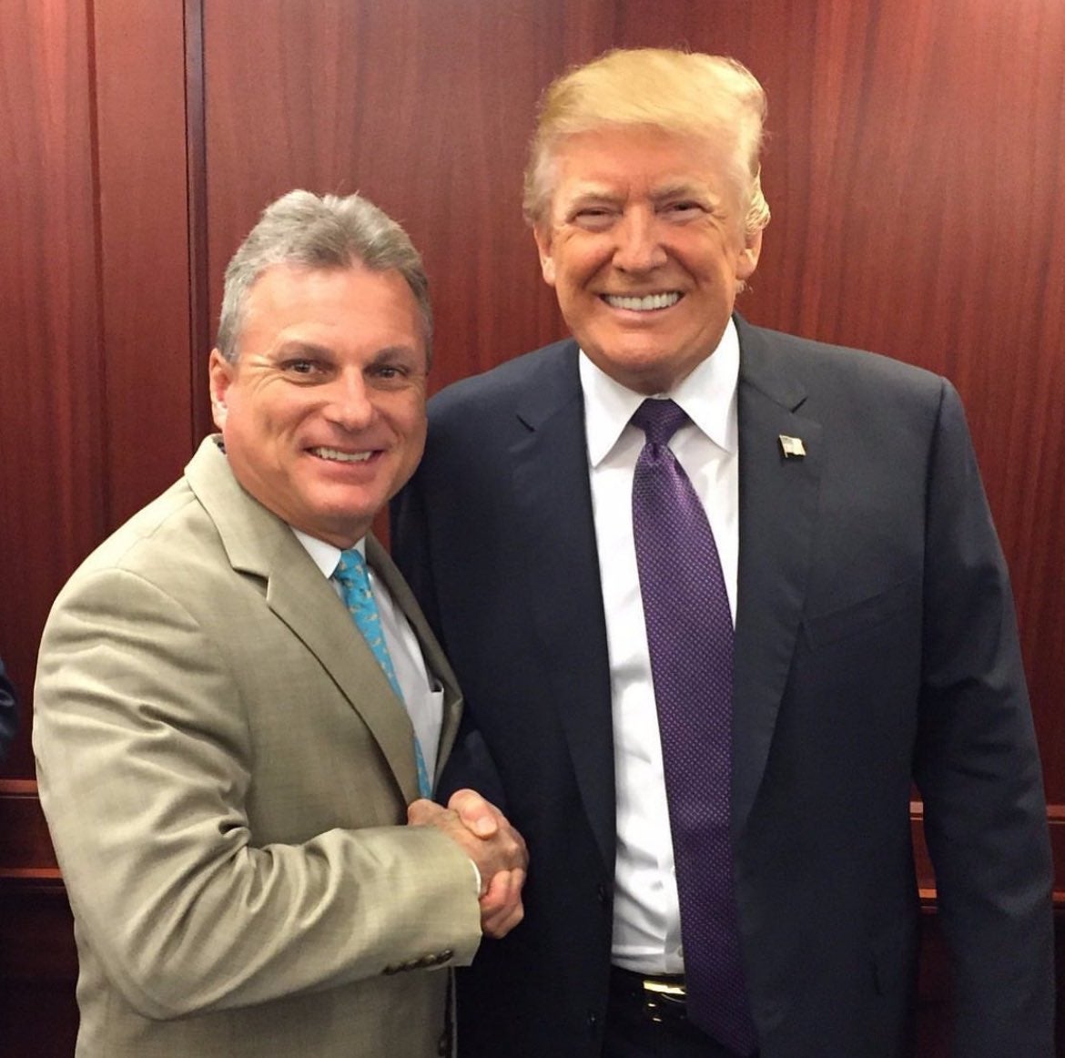 Buddy Carter (left), photographed with Donald Trump, has revealed his red, white and Blueland Act