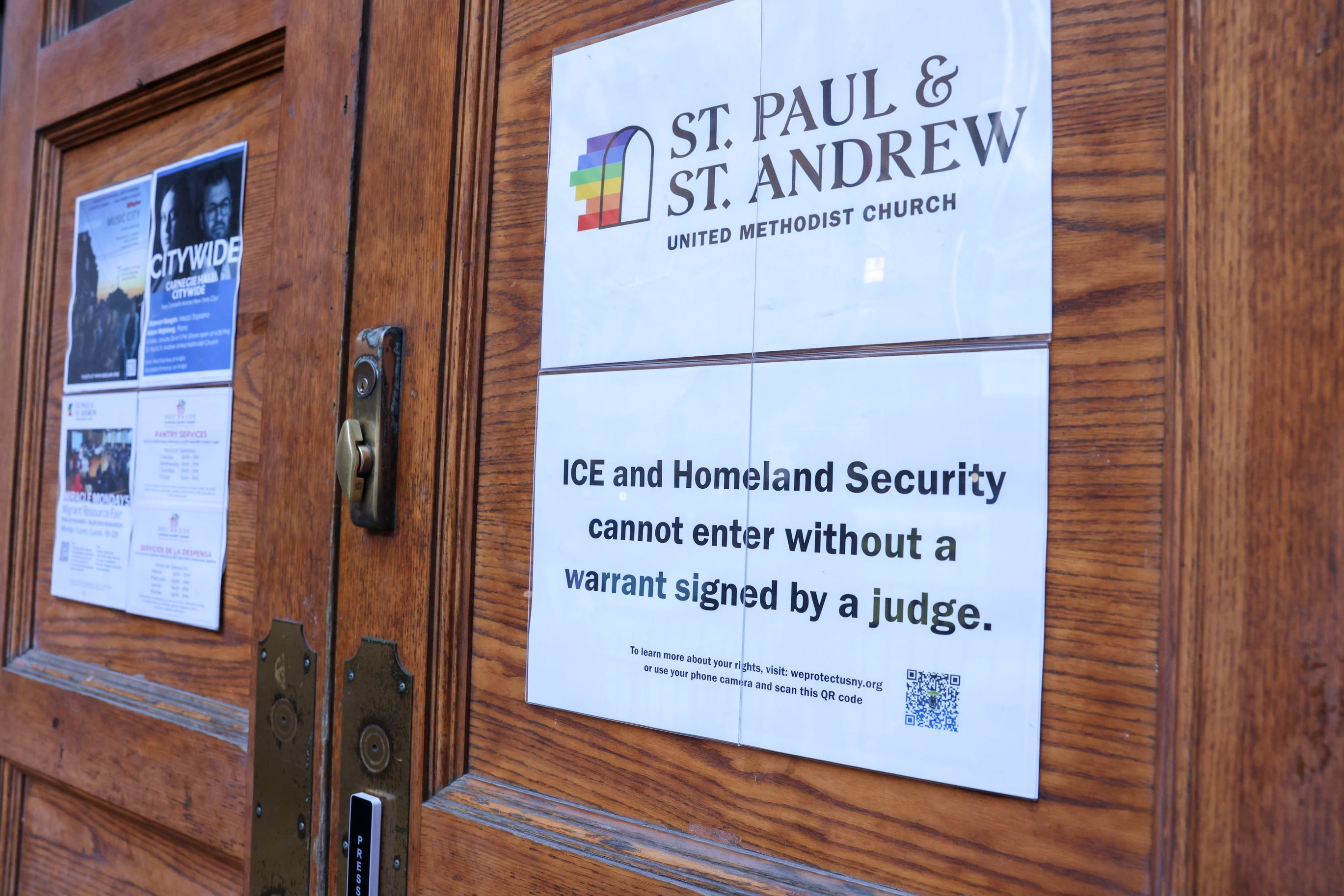 A sign on the door of St. Paul and St. Andrews United Methodist Church in New York City reads that Immigration and Customs Enforcement and Homeland Security cannot enter without a warrant signed by a judge
