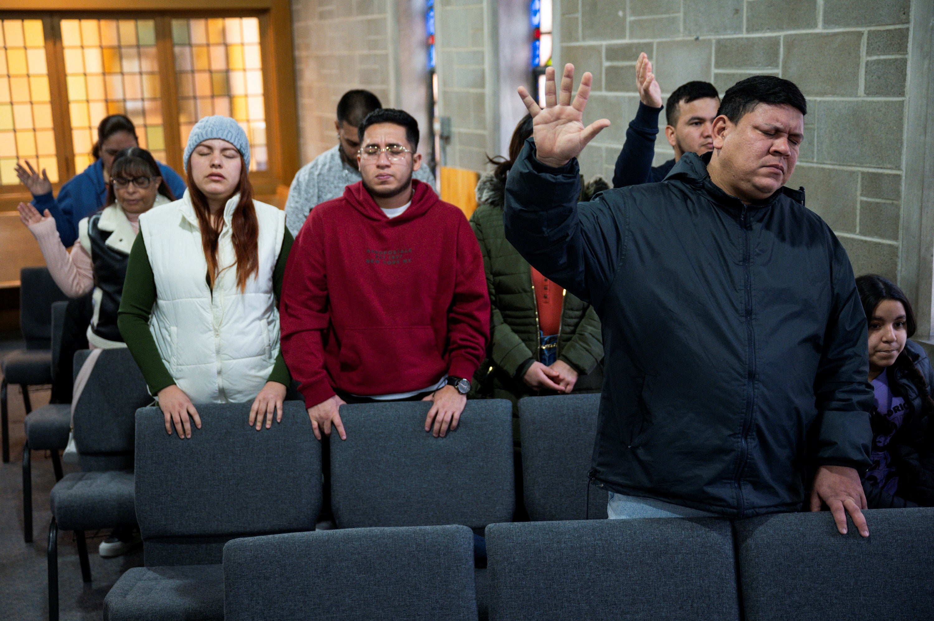 People gather during a service at Chicago’s Starting Point Community Church, which assists members of the newly arrived migrant community, on January 26