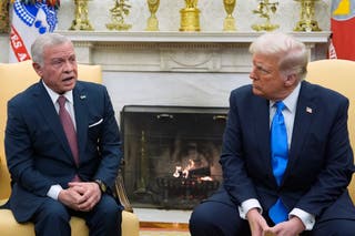 President Donald Trump speaks with Jordan's King Abdullah II in the Oval Office at the White House