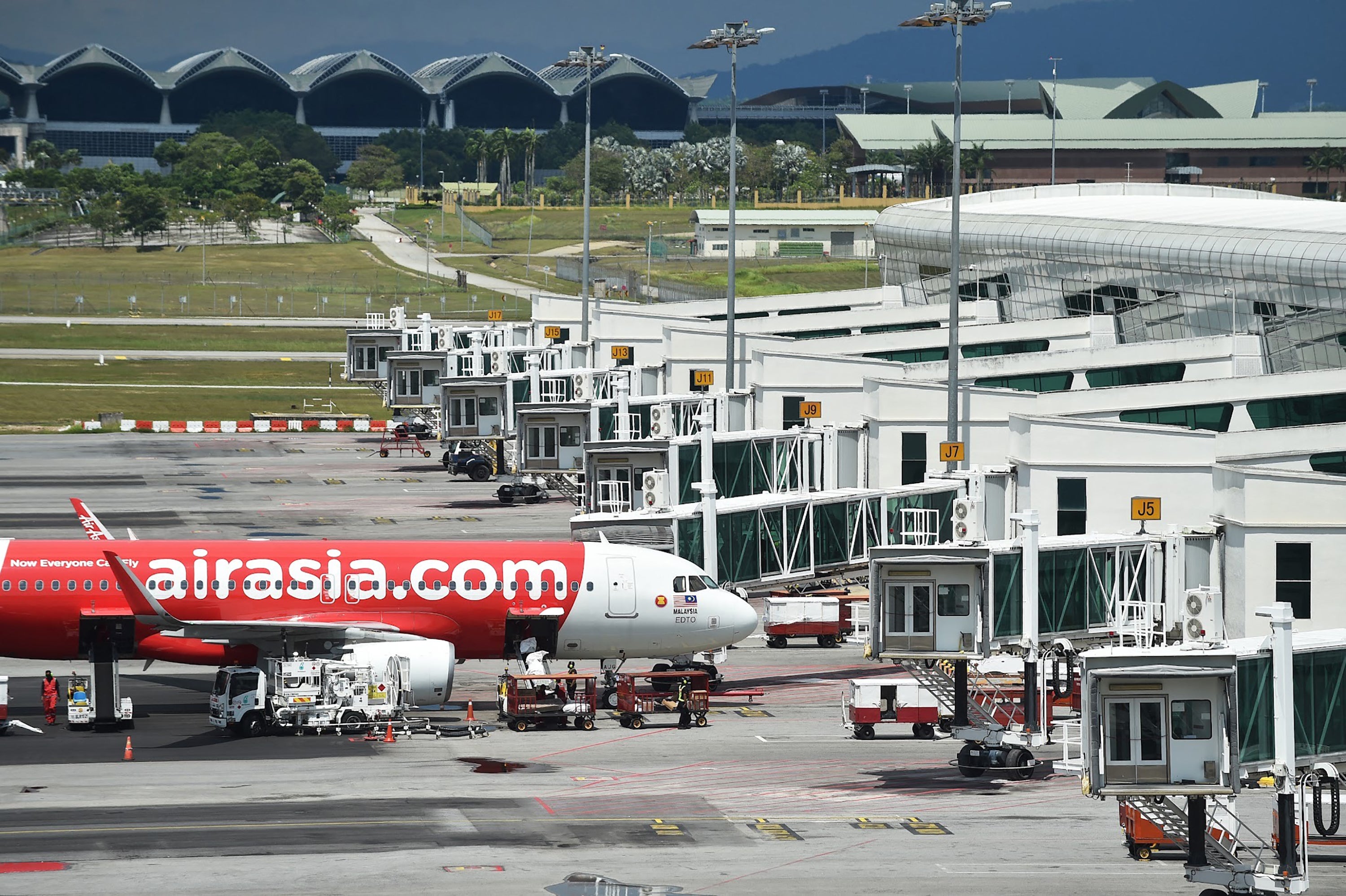 File: AirAsia Airbus A320 aircraft is seen on the tarmac at the Kuala Lumpur international airport on 8 March 2022