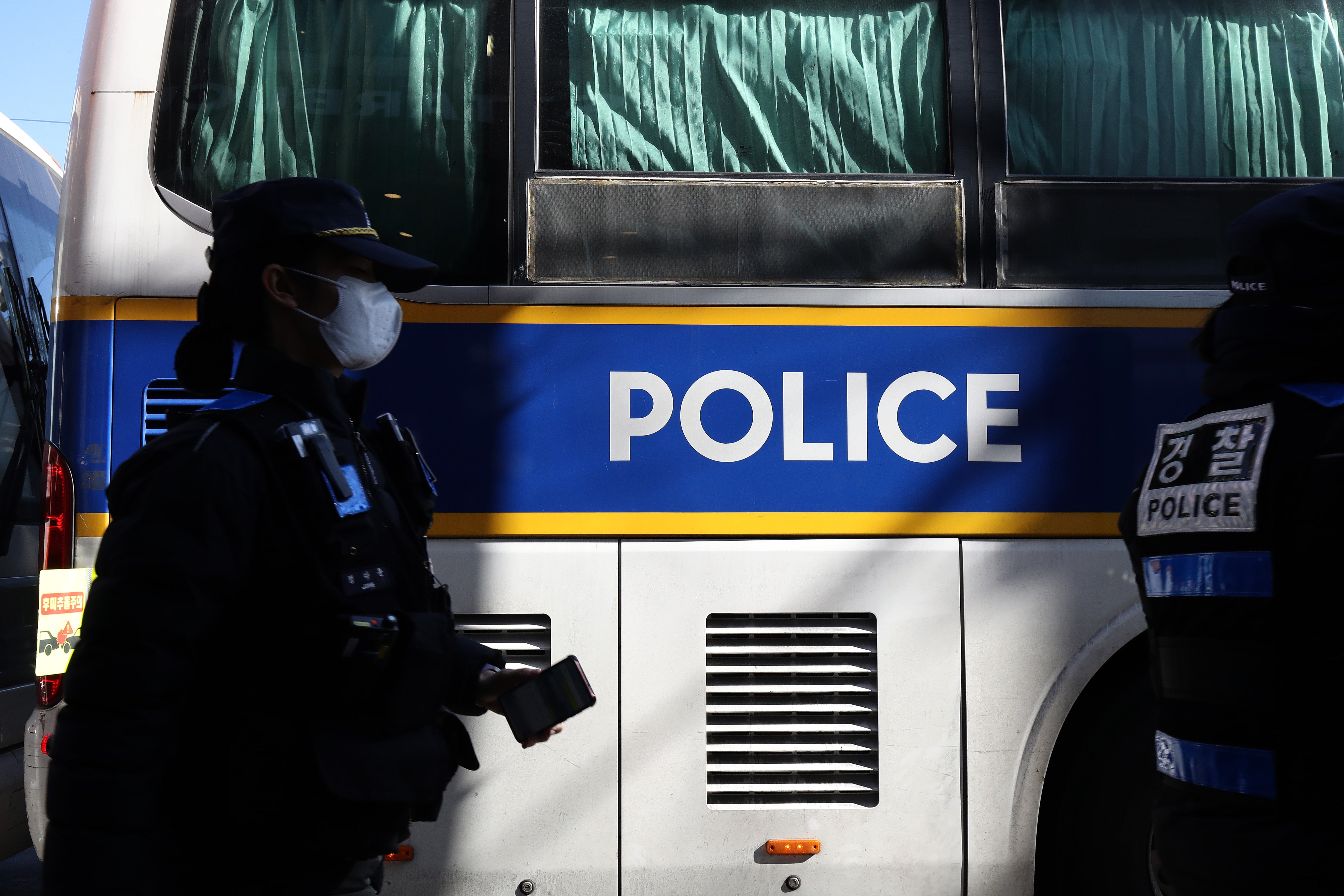 File. South Korean police officers stand guard