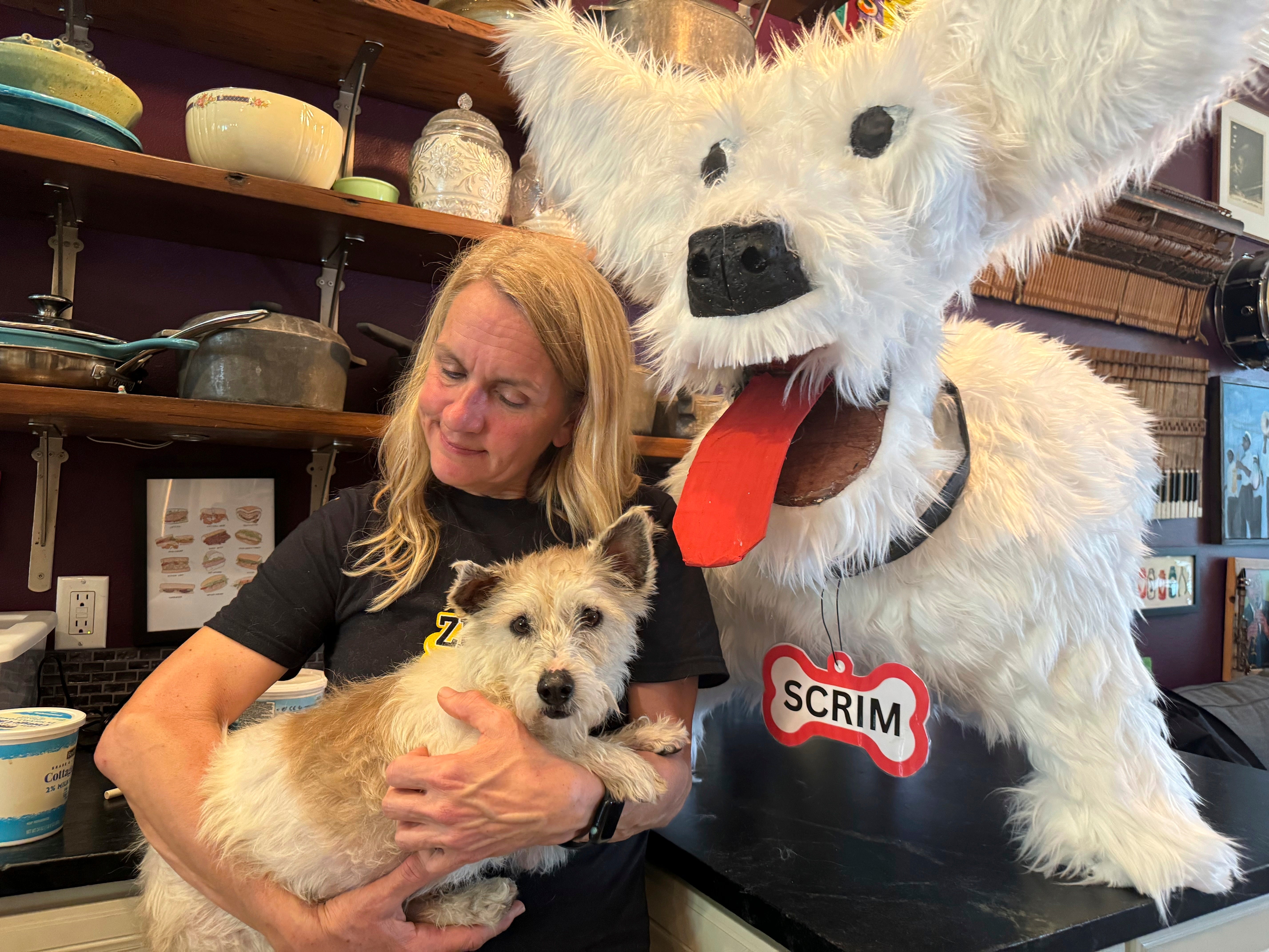 Scrim, pictured with Michelle Cheramie of of animal rescue nonprofit Zeus Rescues, was recaptured on Tuesday