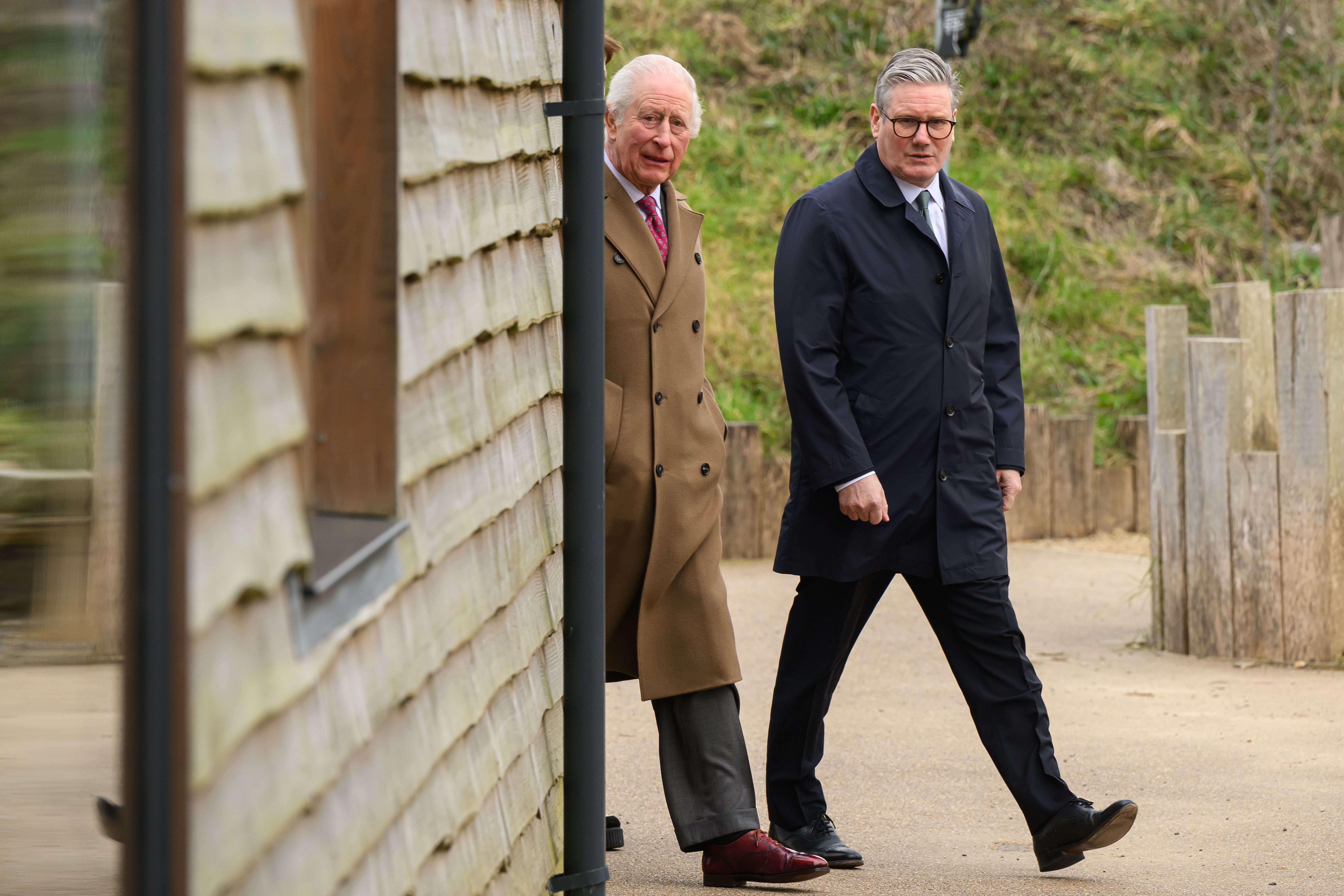 The King and Prime Minister Keir Starmer (right) arrive for a visit to Newquay Orchard in Cornwall (Leon Neal/PA)