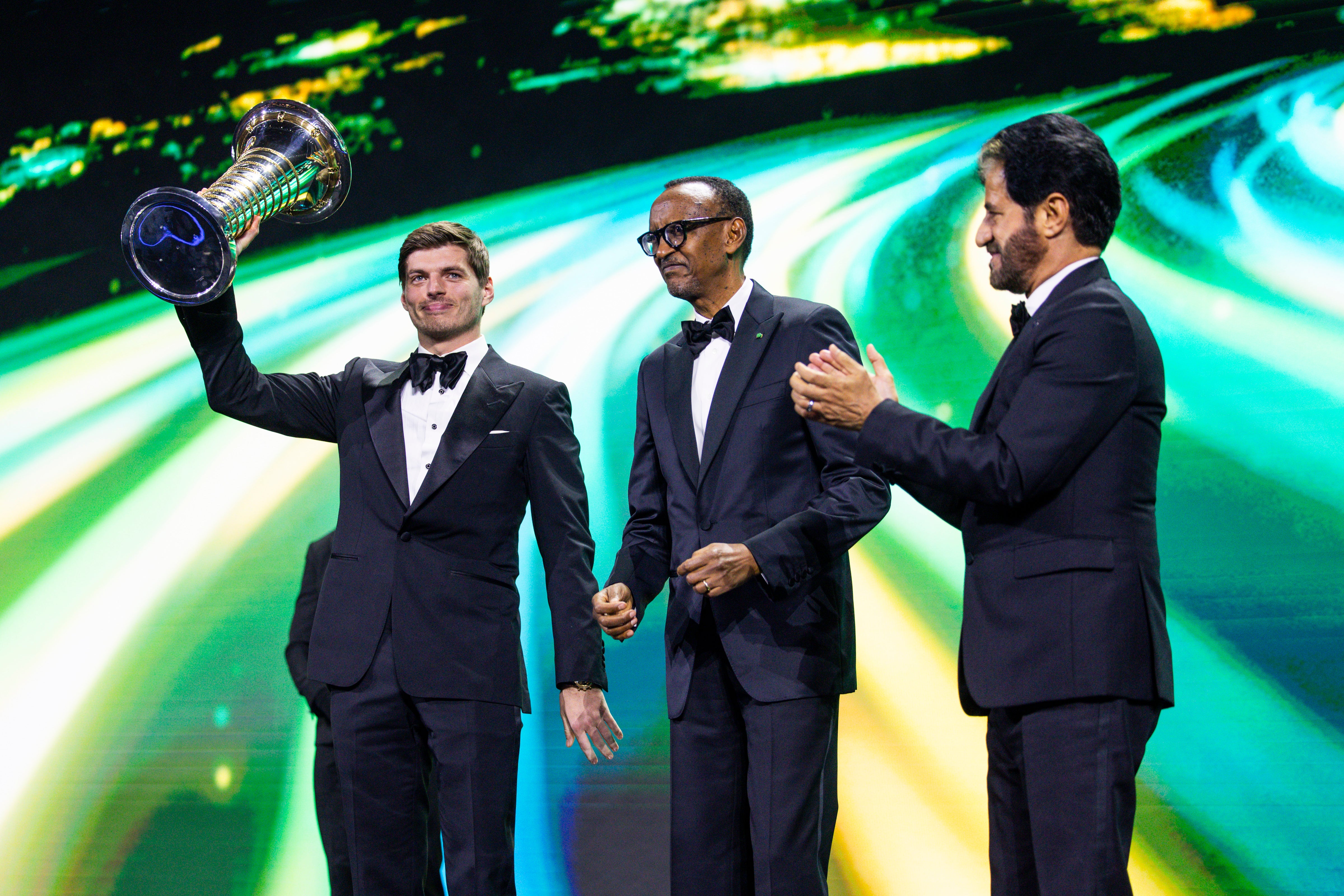 Rwanda president Paul Kagame (centre) presented Max Verstappen with his trophy at the FIA end-of-season gala in December