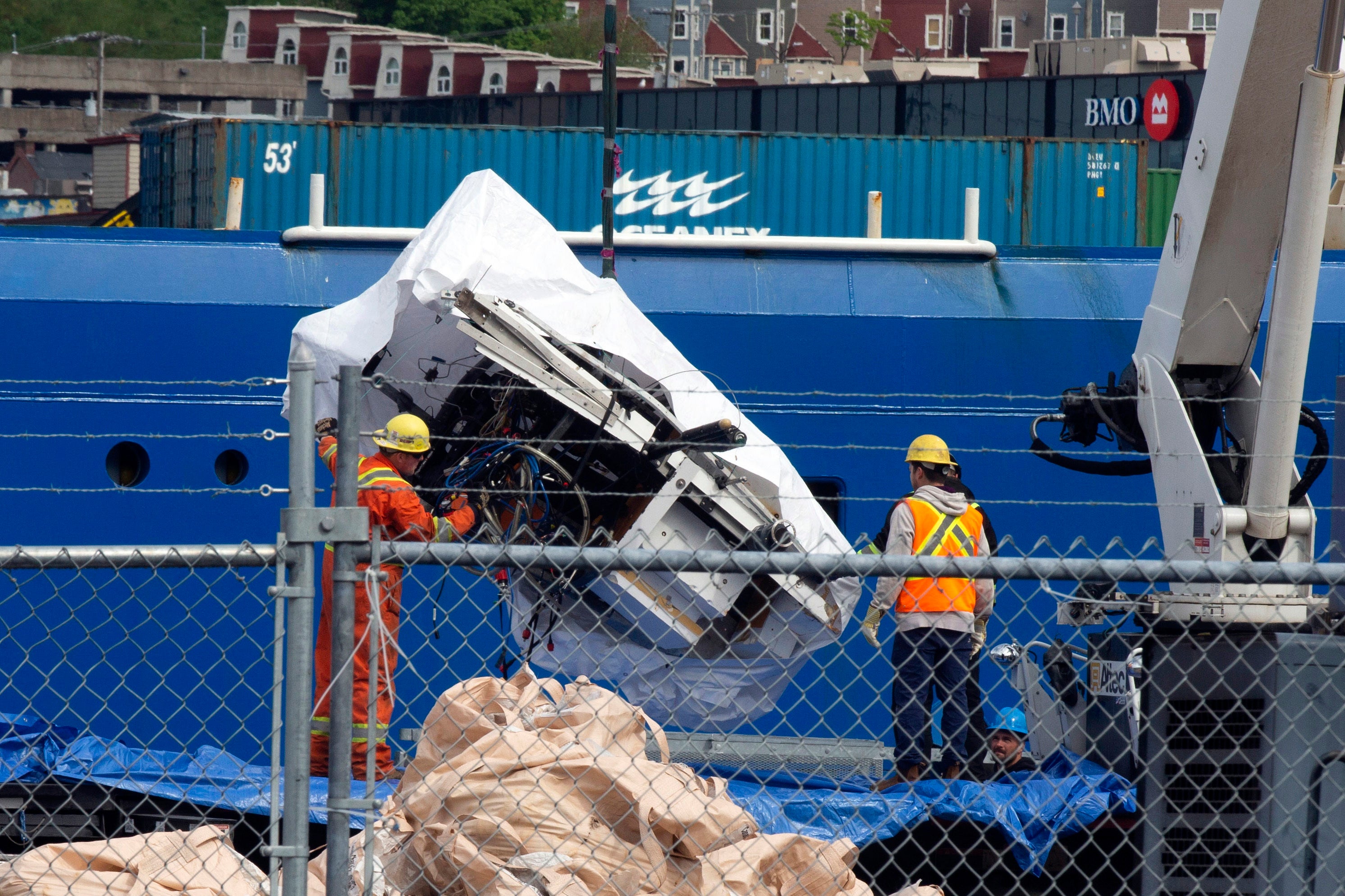 Debris from the Titan submersible, recovered from the ocean floor near the wreck of the Titanic, is unloaded from the ship Horizon Arctic at the Canadian Coast Guard pier in St. John's, Newfoundland, Wednesday, June 28, 2023