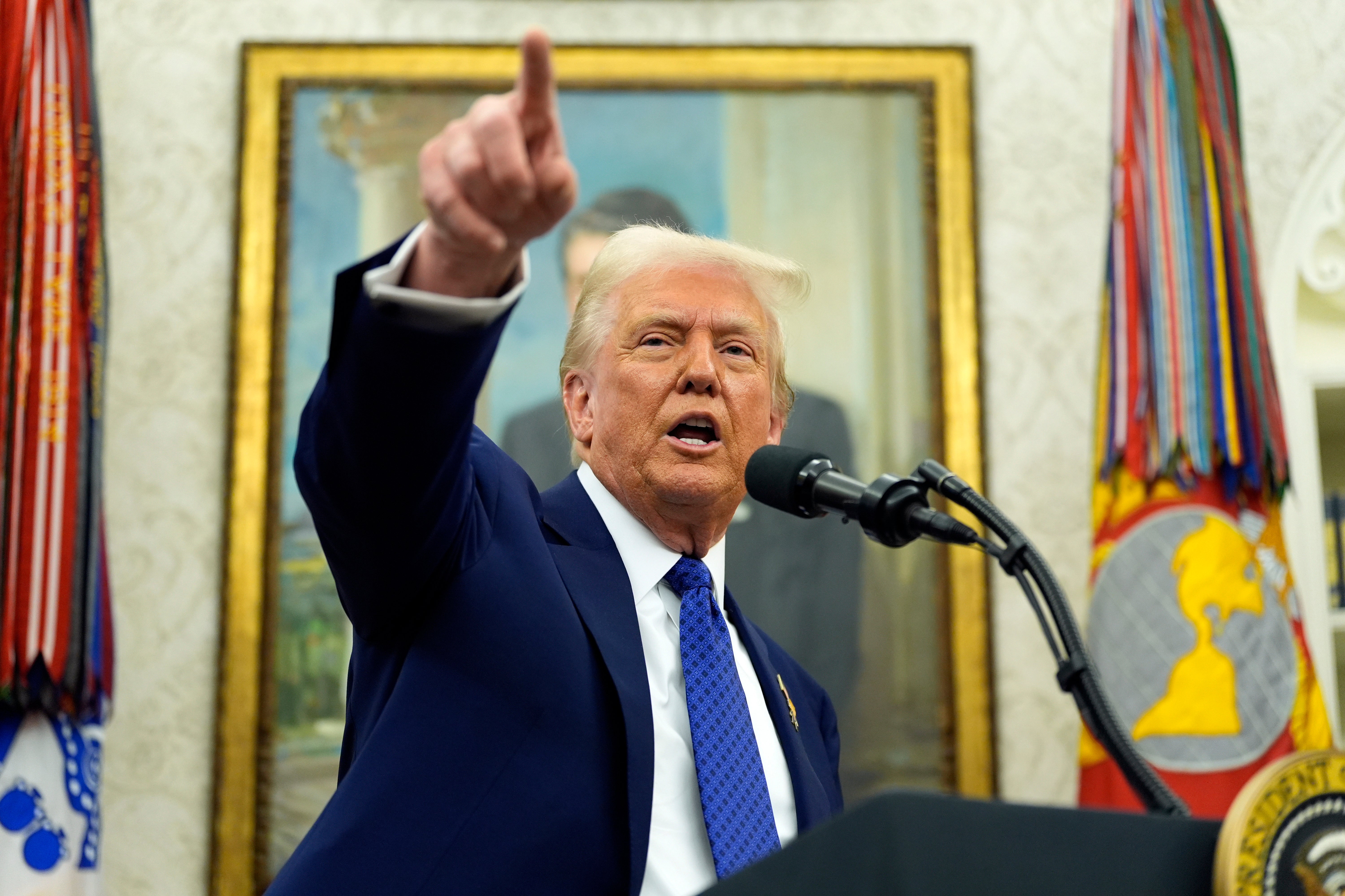 President Donald Trump speaks as Tulsi Gabbard is sworn in as the Director of National Intelligence in the Oval Office of the White House, Wednesday, Feb. 12, 2025, in Washington. (Photo/Alex Brandon)