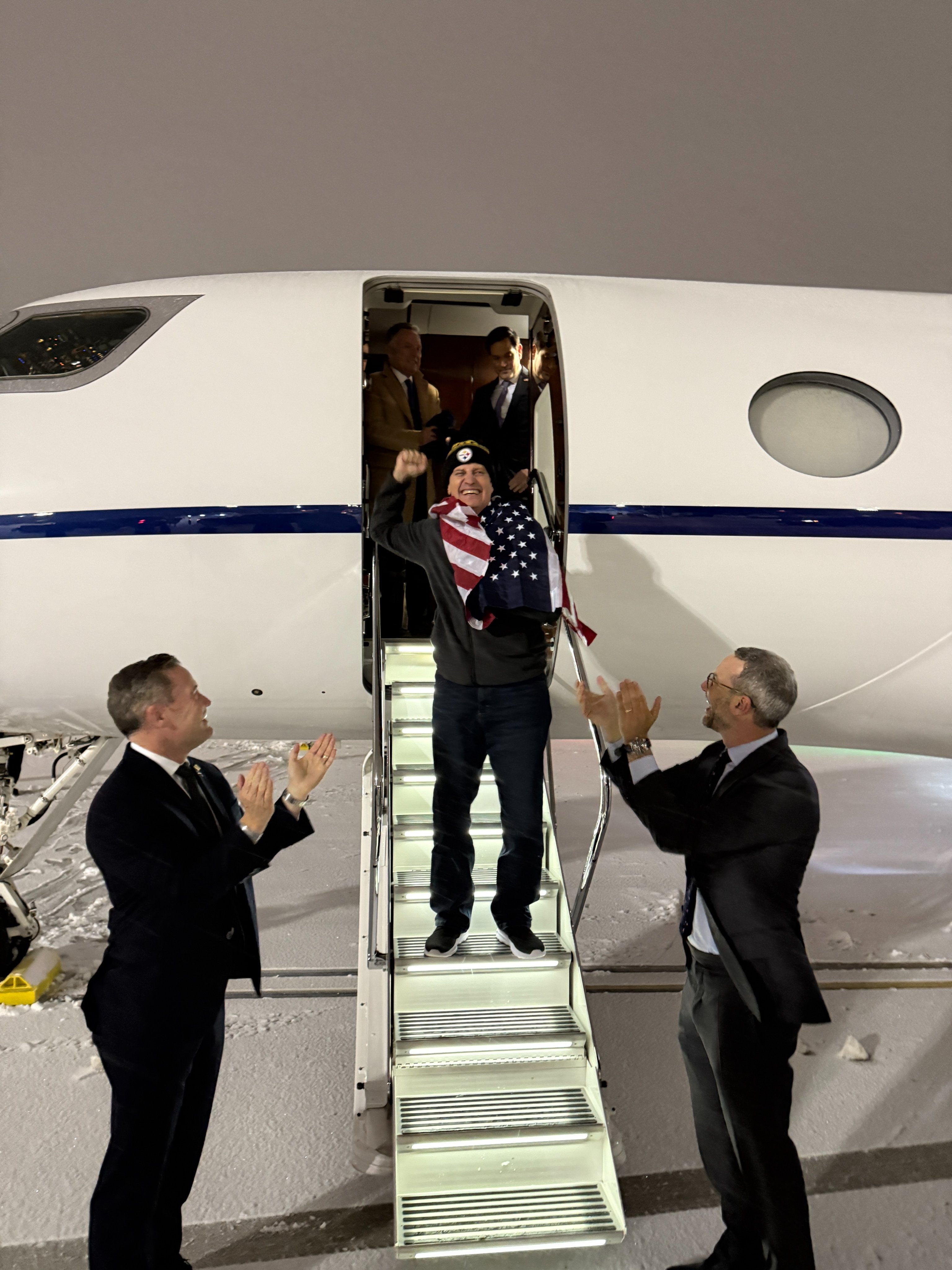 Fogel was pictured jubilantly punching the air as he landed back in the U.S.