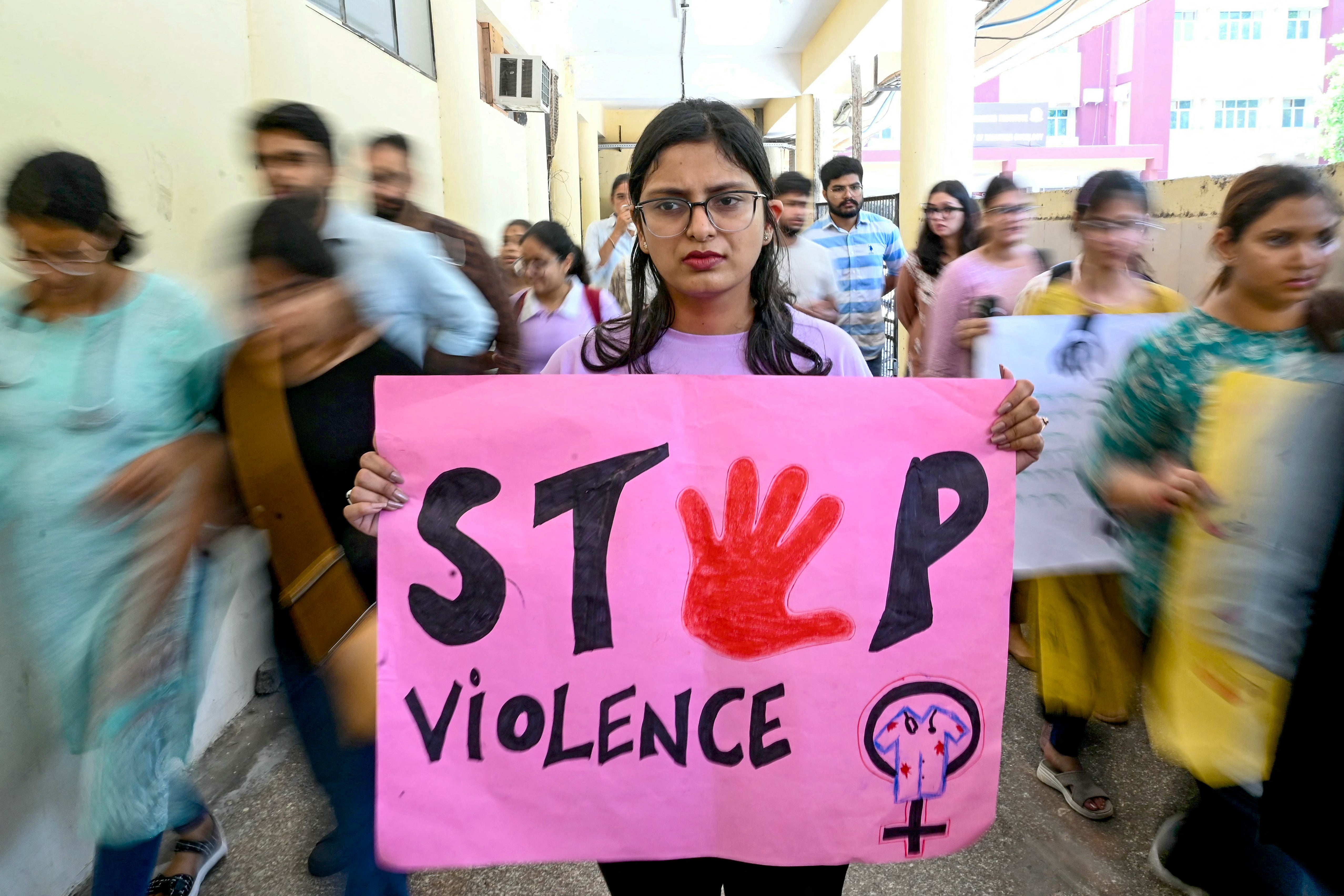 File. A medical worker takes part in a protest against the rape and murder of a doctor in a hospital in Kolkata city, India